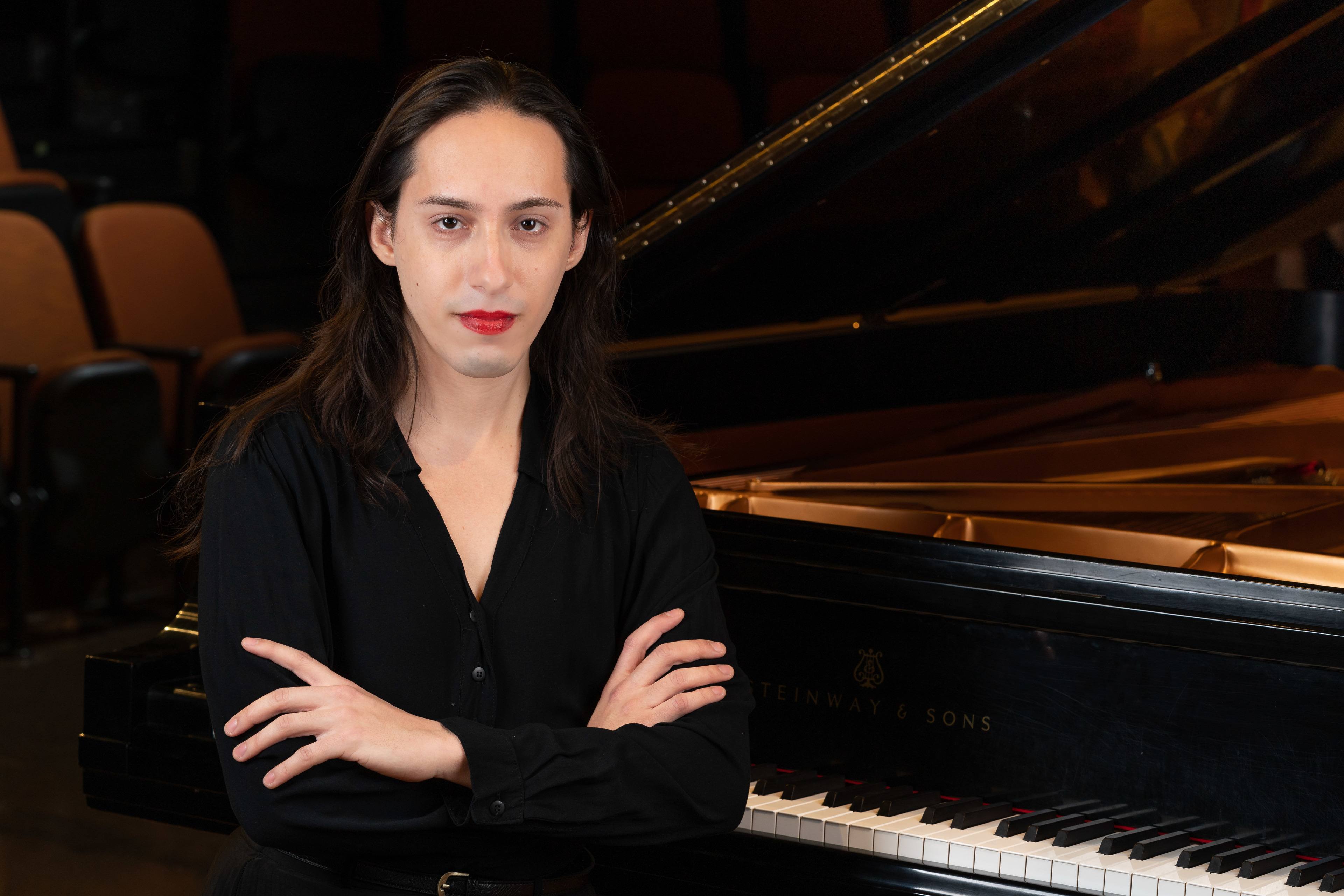 BGSU DMA Student Francisca de Castanheiro de Freitas sitting at a piano
