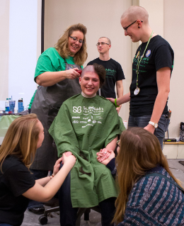 BGSU students support a classmate's generous decision to &#34;go bald&#34; at the annual St. Baldrick's event that raises funds aimed at conquering childhood cancer.