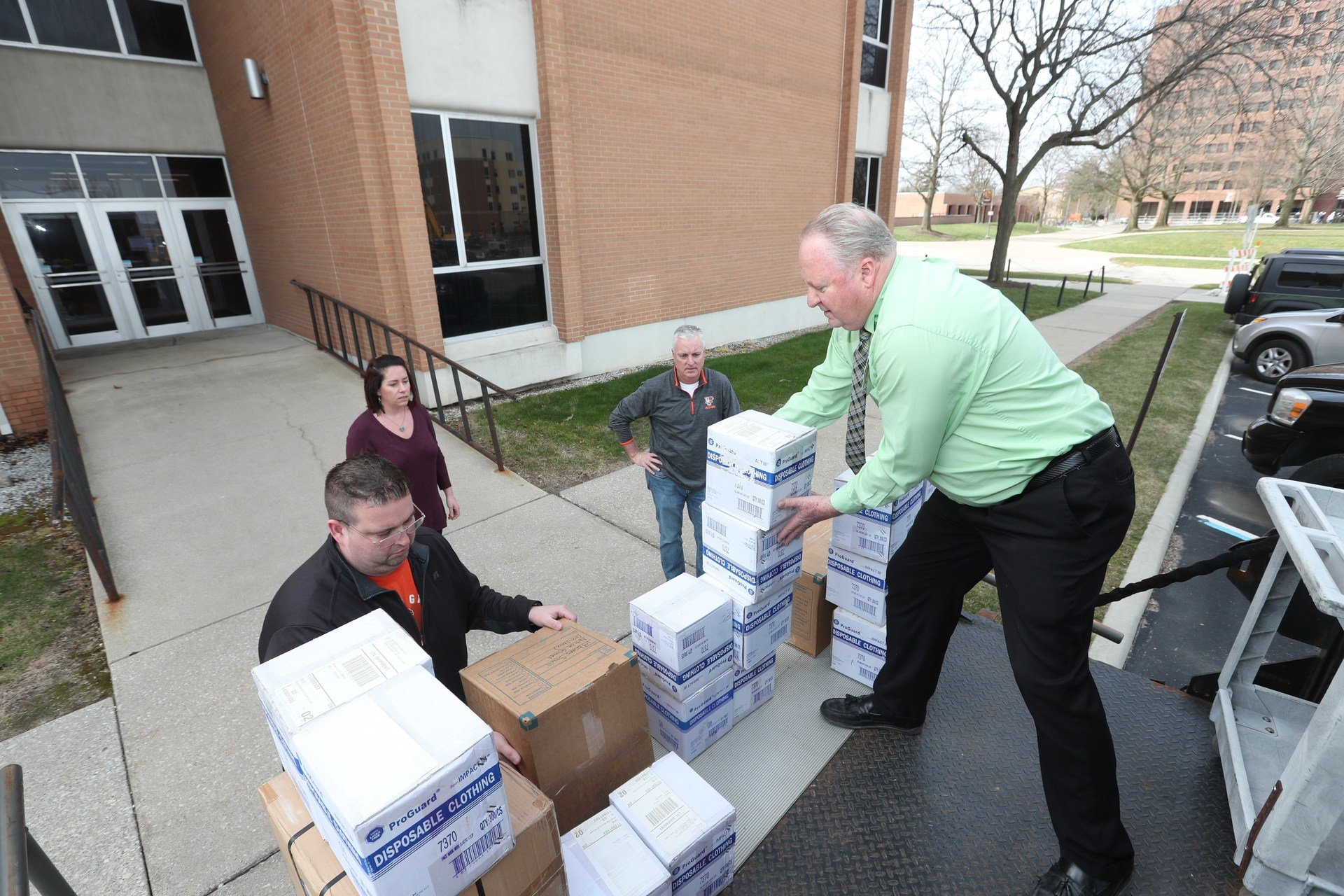 Staff load a truck full of personal protective equipment to be donated to local hospitals.