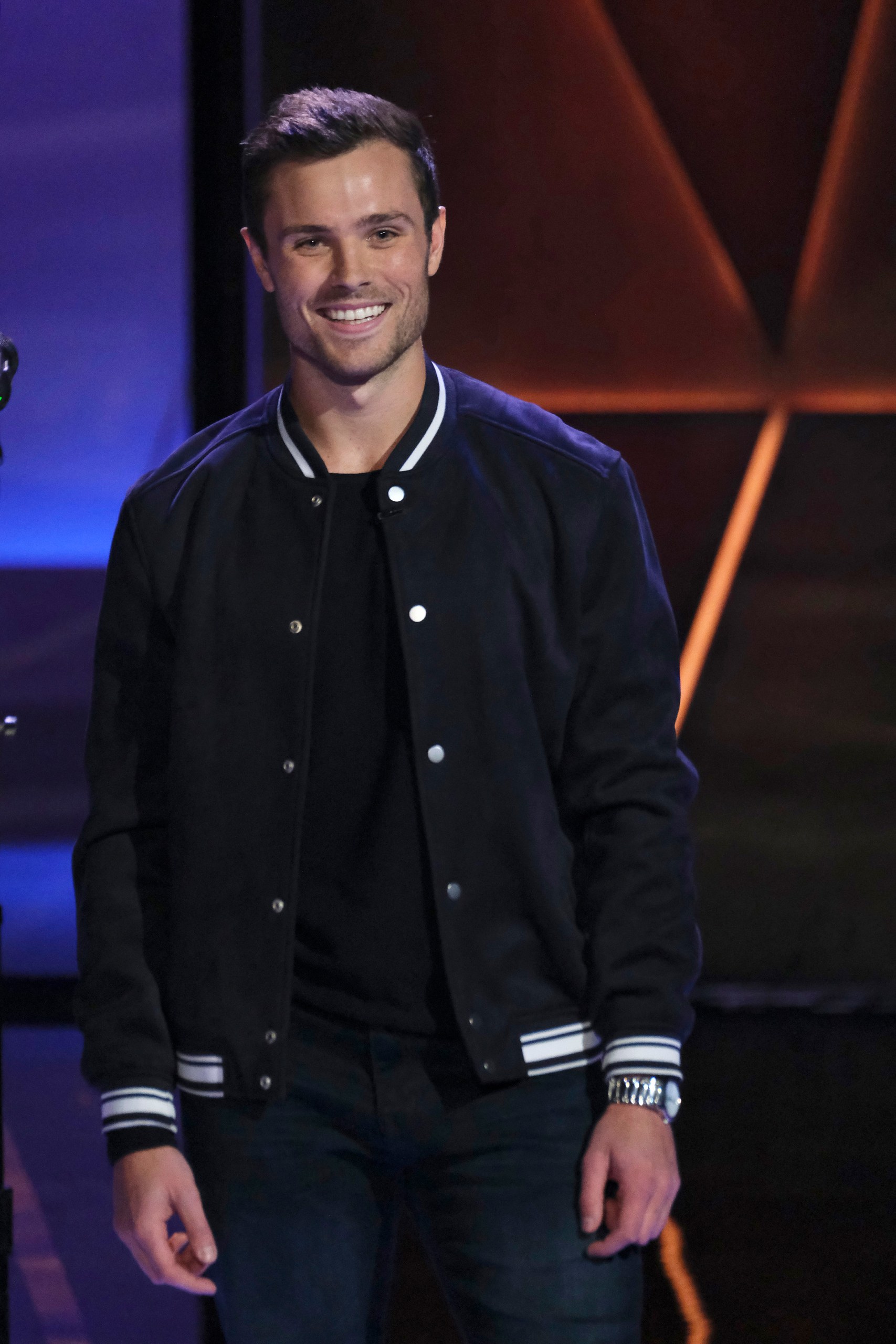 Griffen-Palmer-standing-on-stage-on-set-of-Songland