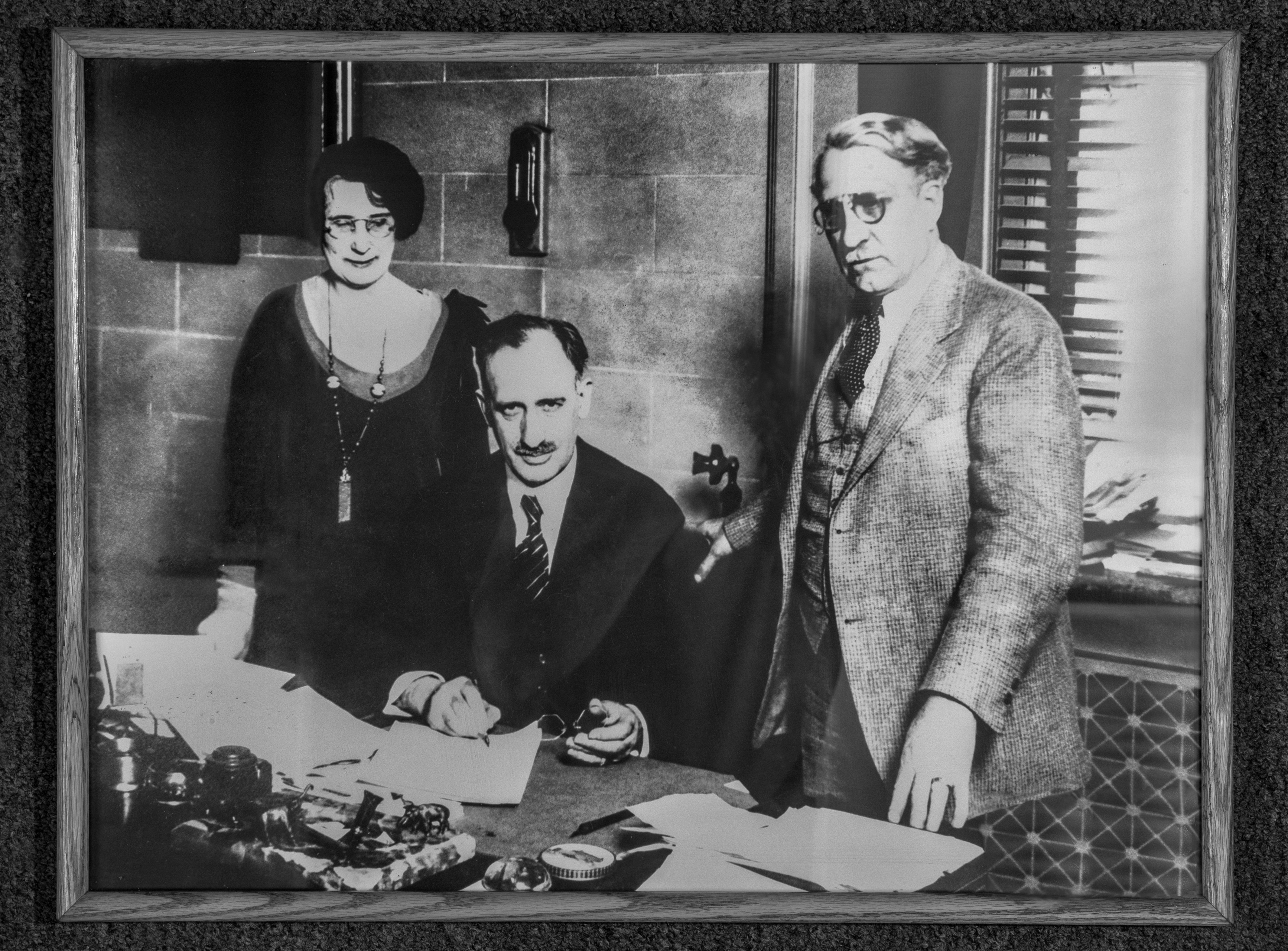 Myrna Hanna joins Gov. Myers Cooper and Sen. Van Everett D. Emmons for the signing of the Emmons-Hanna Bill in 1929.