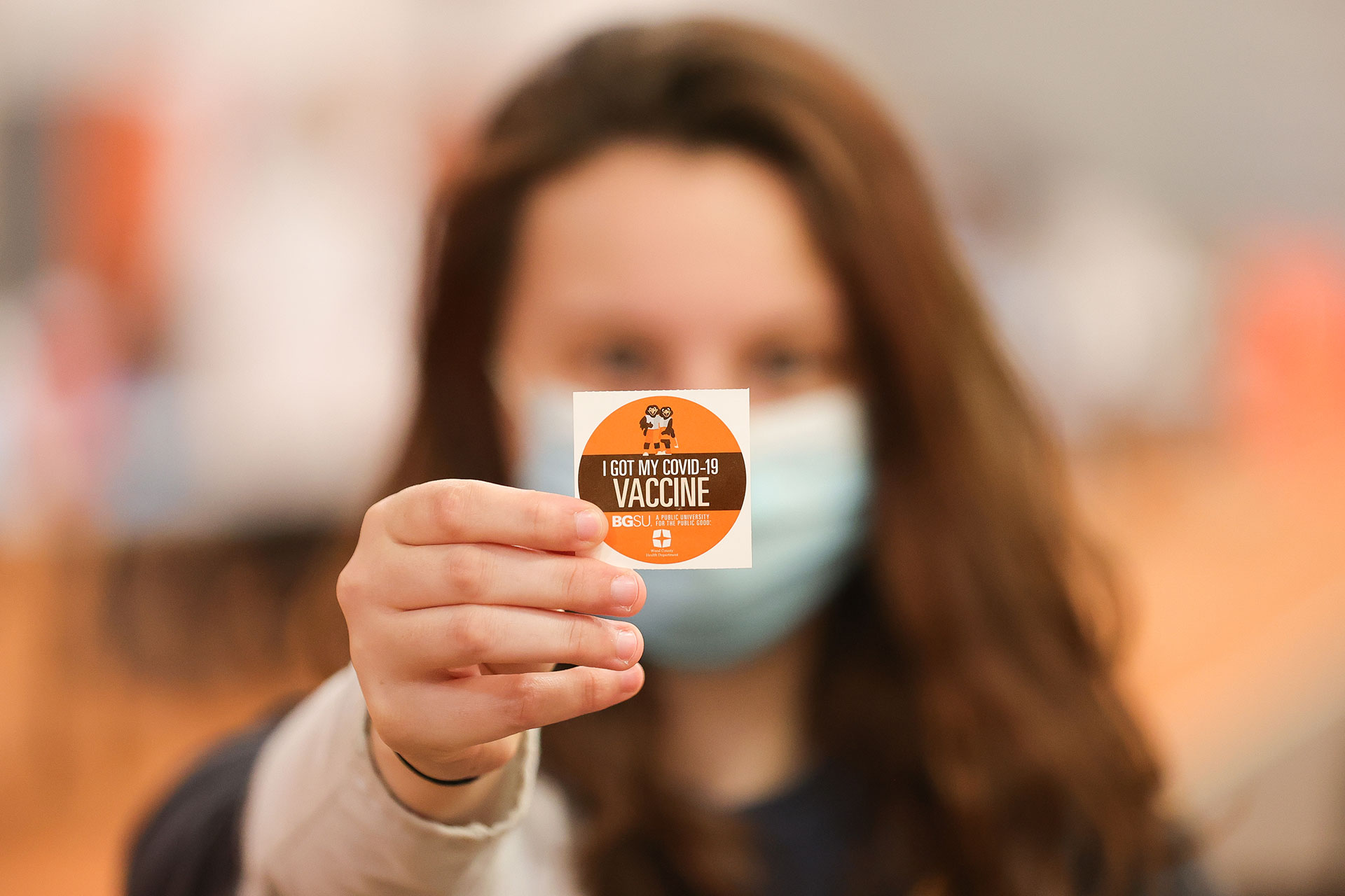 Woman with a 'BGSU I got my COVID-19 Vaccine' sticker