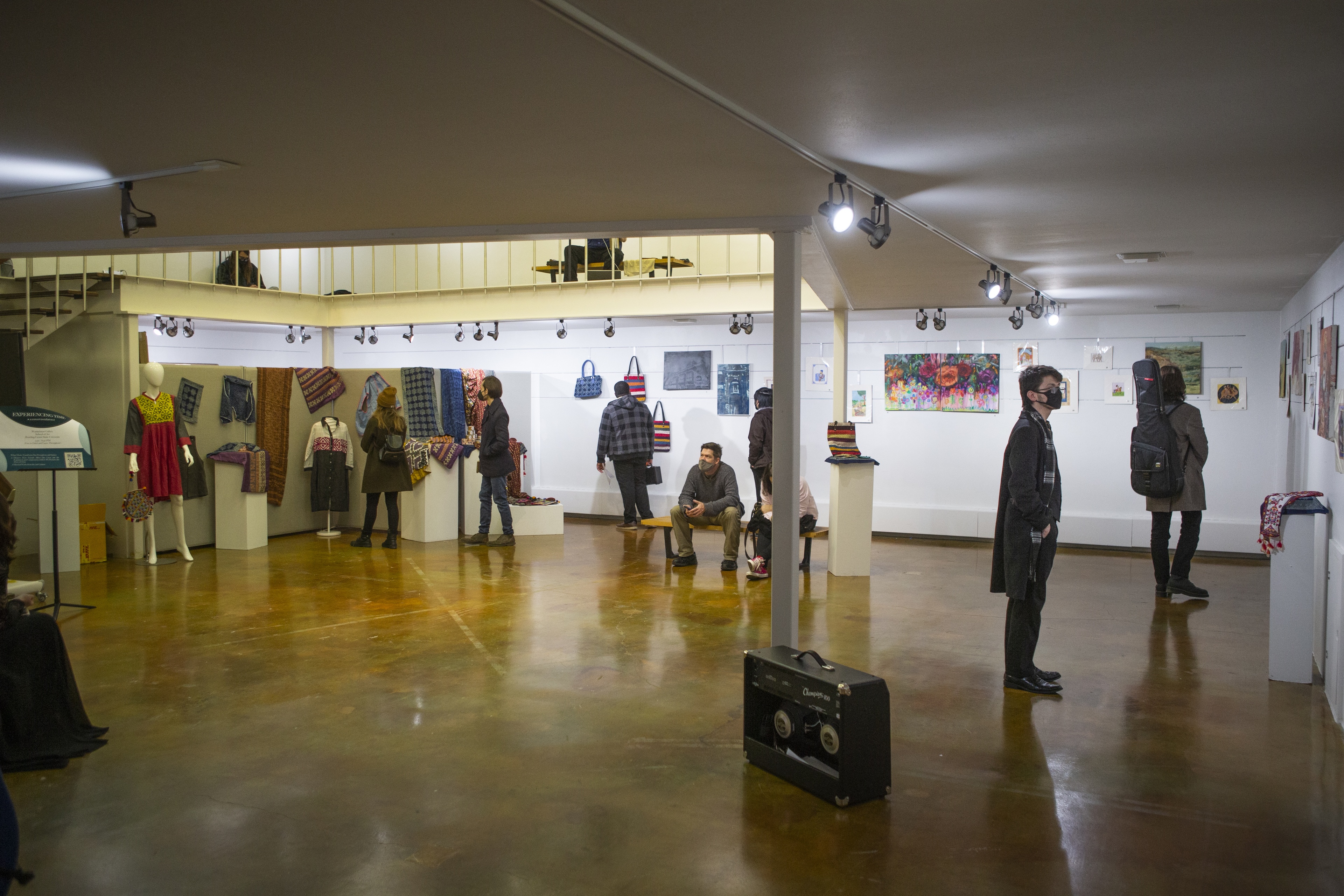 People looking at artwork in a gallery