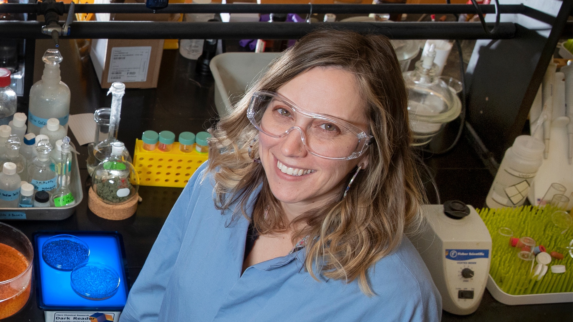 Dr. Alexis Ostrowski smiling in the lab