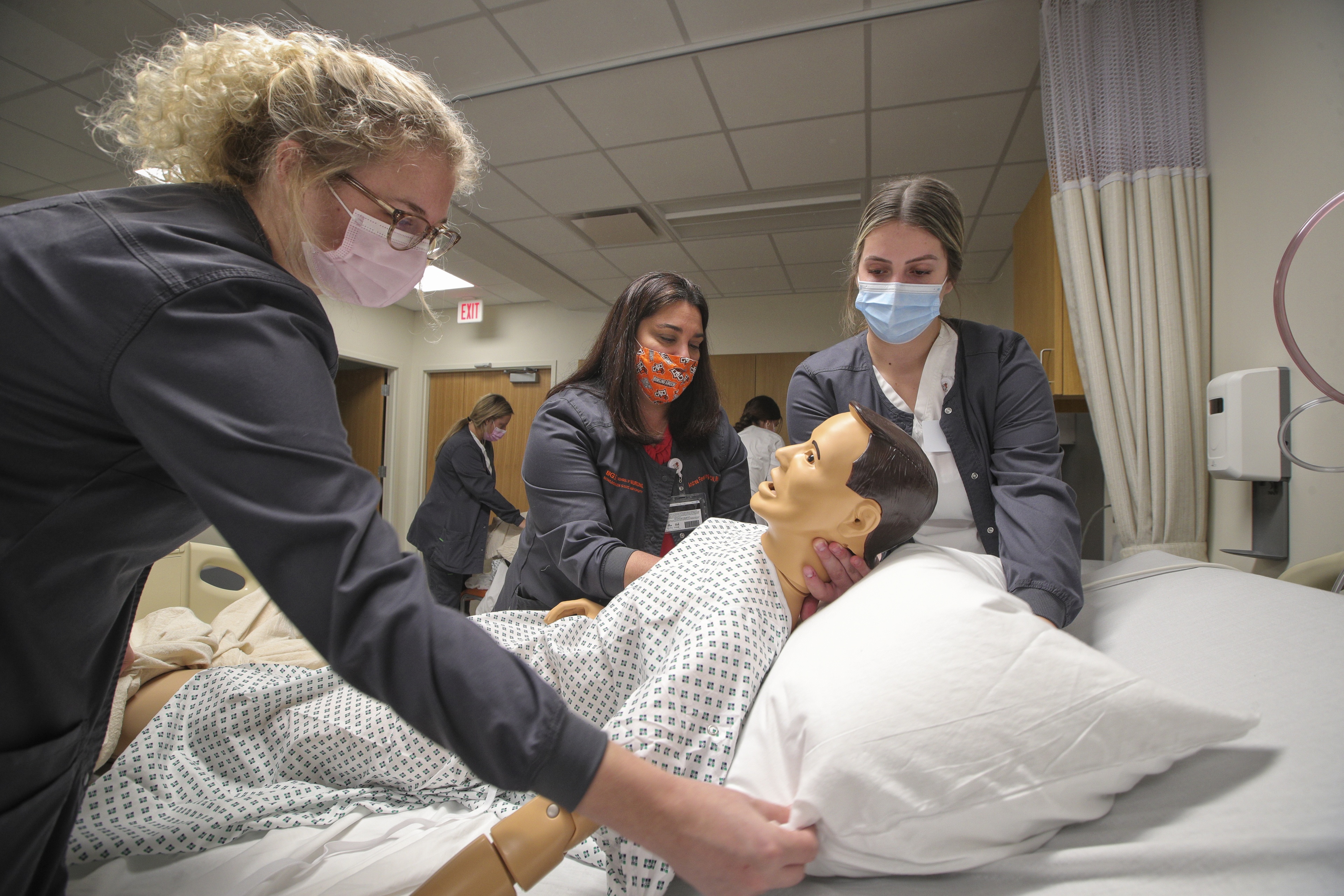 (Left-to-right) Jaelyn Withem, a junior from Columbus, practices techniques with Andrea Flewelling, assistant clinical instructor, and Alivia Bolin, also a junior from Columbus. 