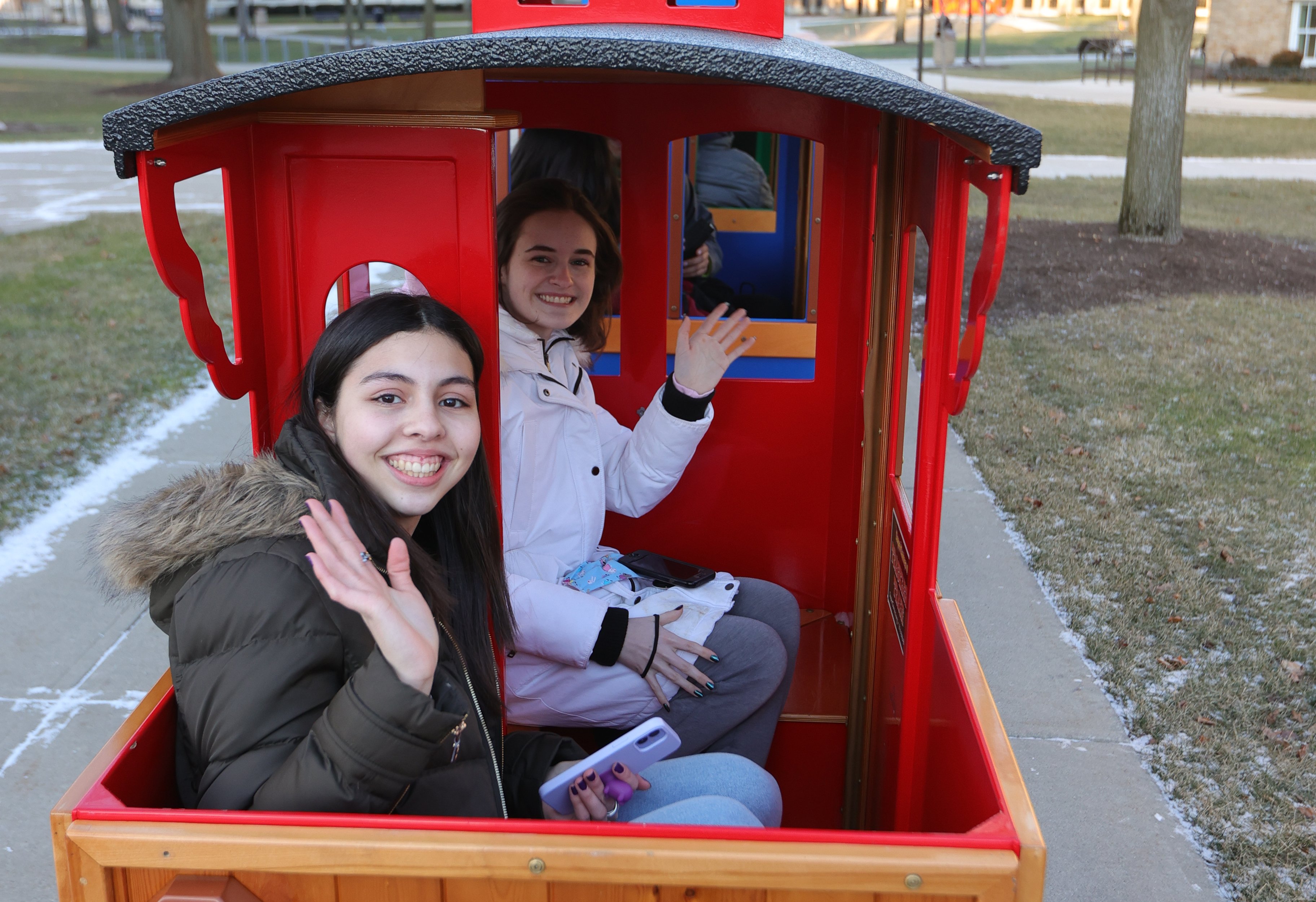 Students waving on train at Winter Wonderland 2022