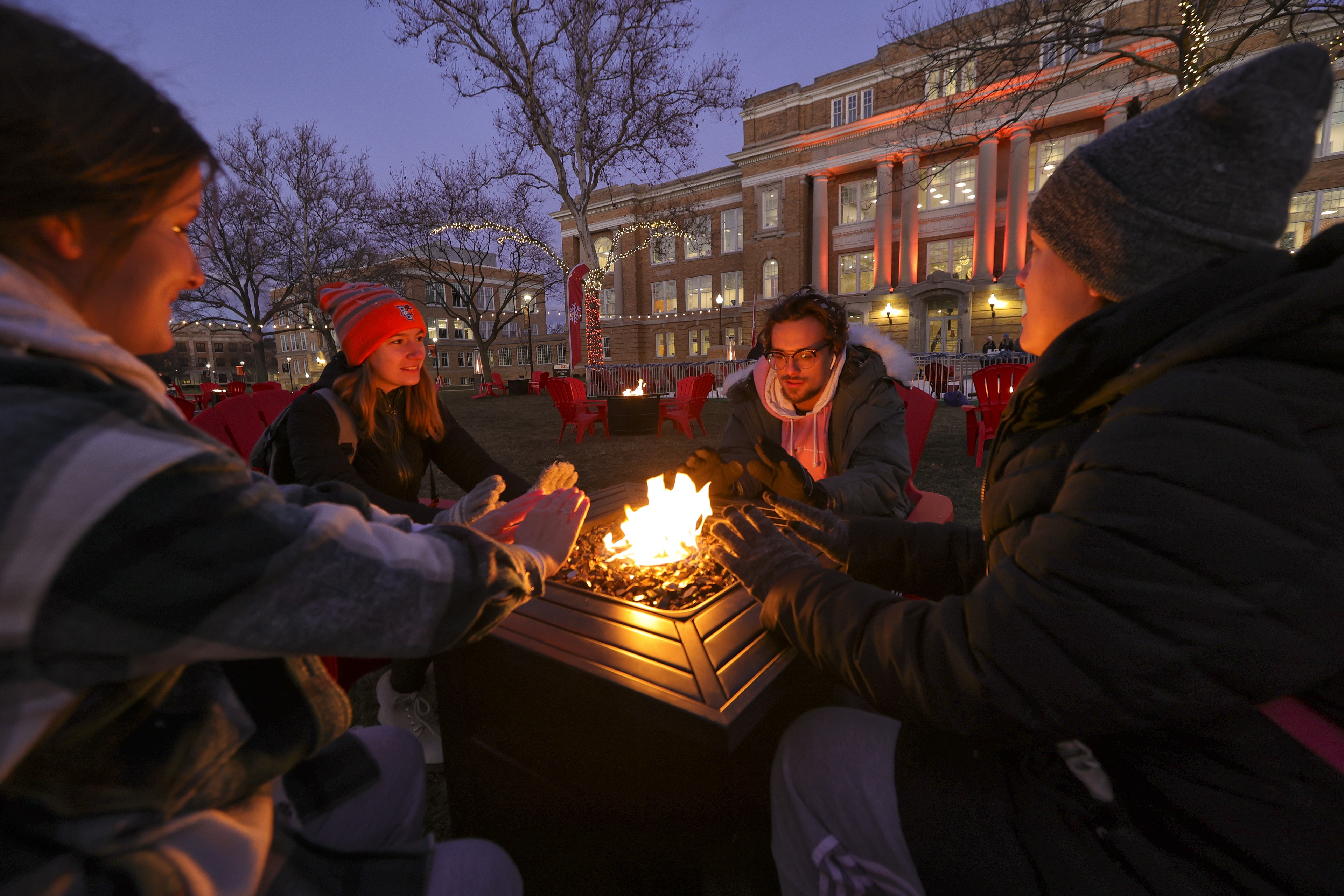 Students around firepit at Winter Wonderland 2022