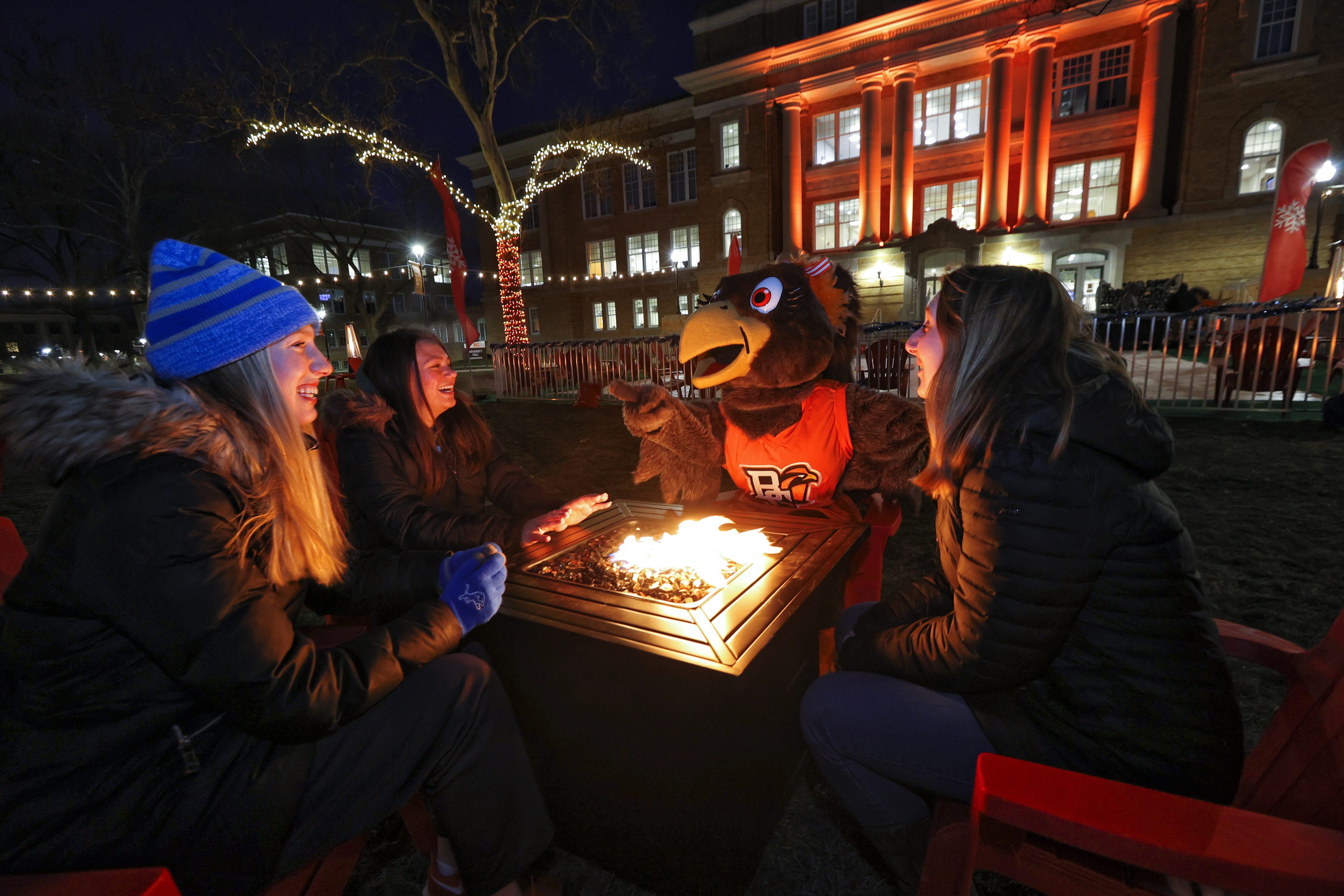 Frieda and students by the fire at Winter Wonderland 2022