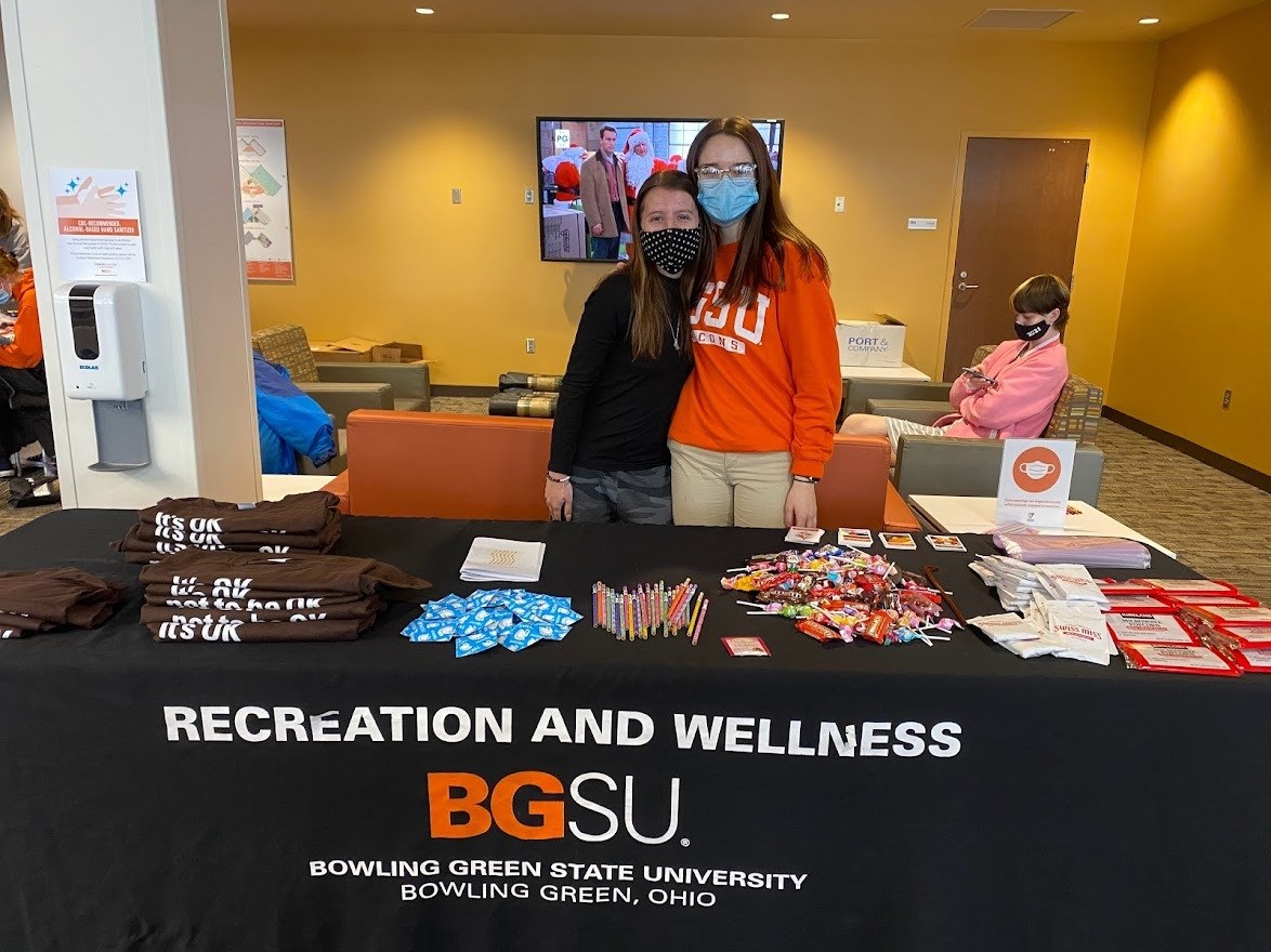Haley Lutz (left) and Jenna Binger (right) are at the Health and Wellness table 