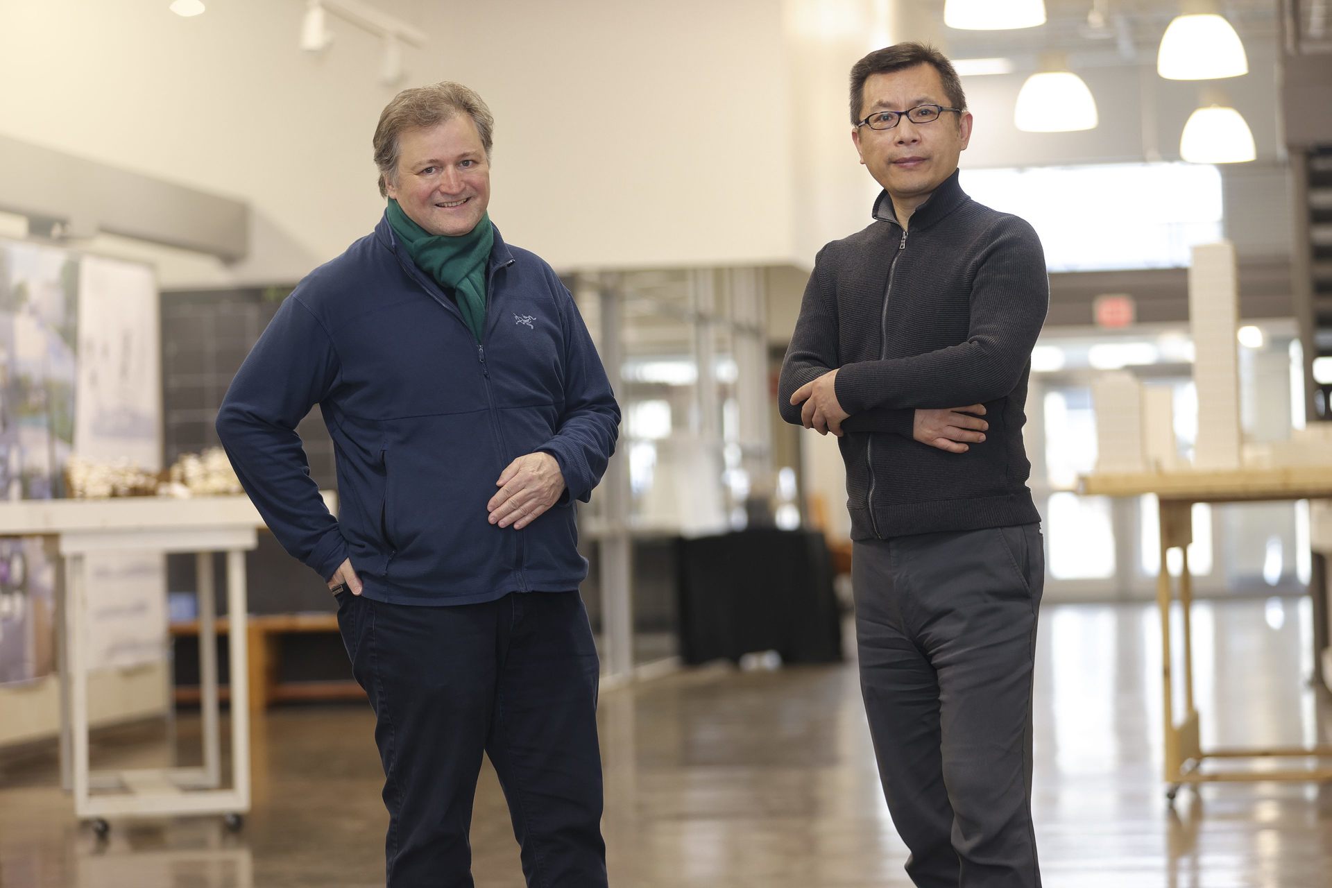 Huang and Luescher standing next to each other