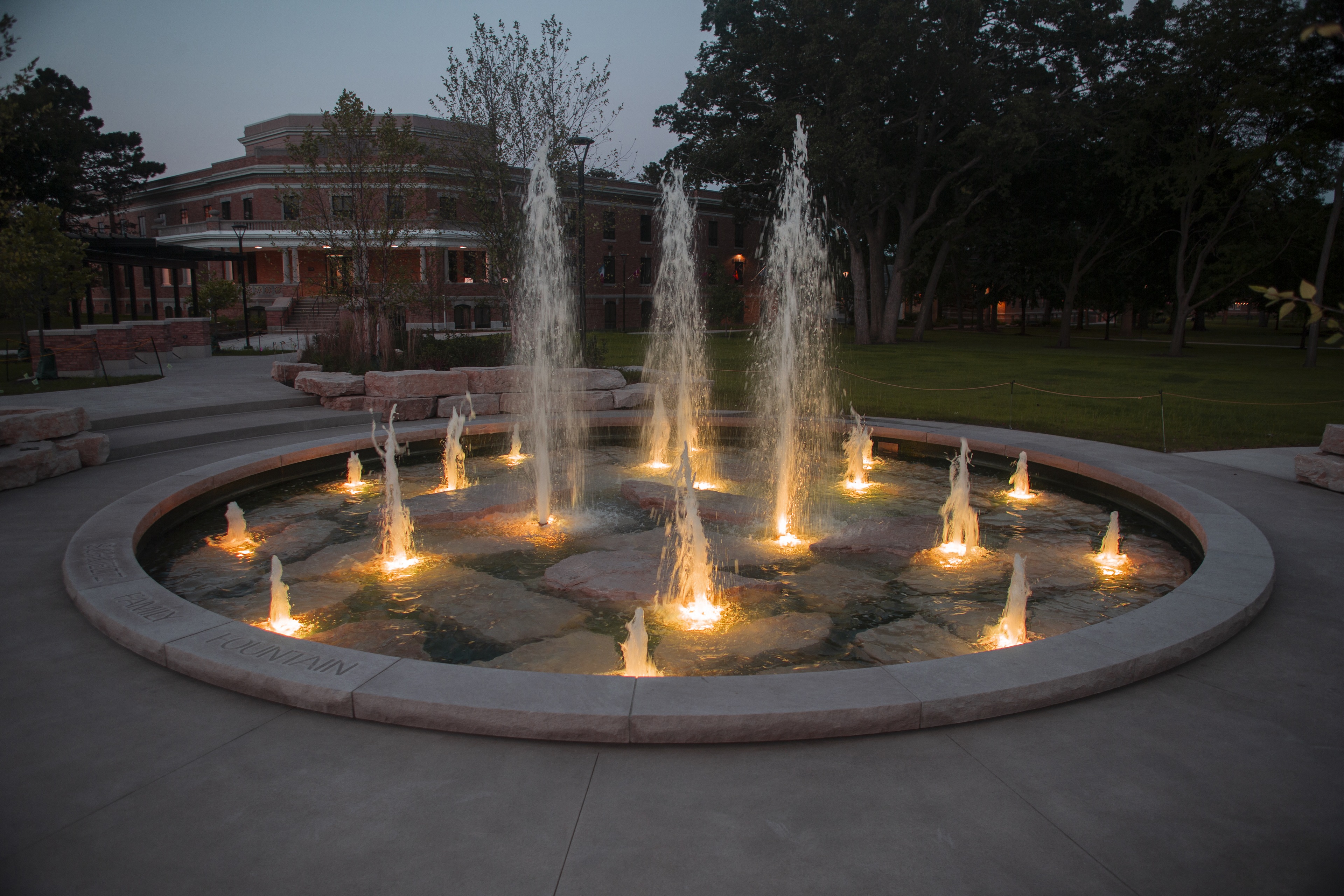 fountain at night with lights in the water