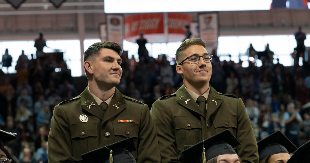 2 military members stand at BGSU graduation