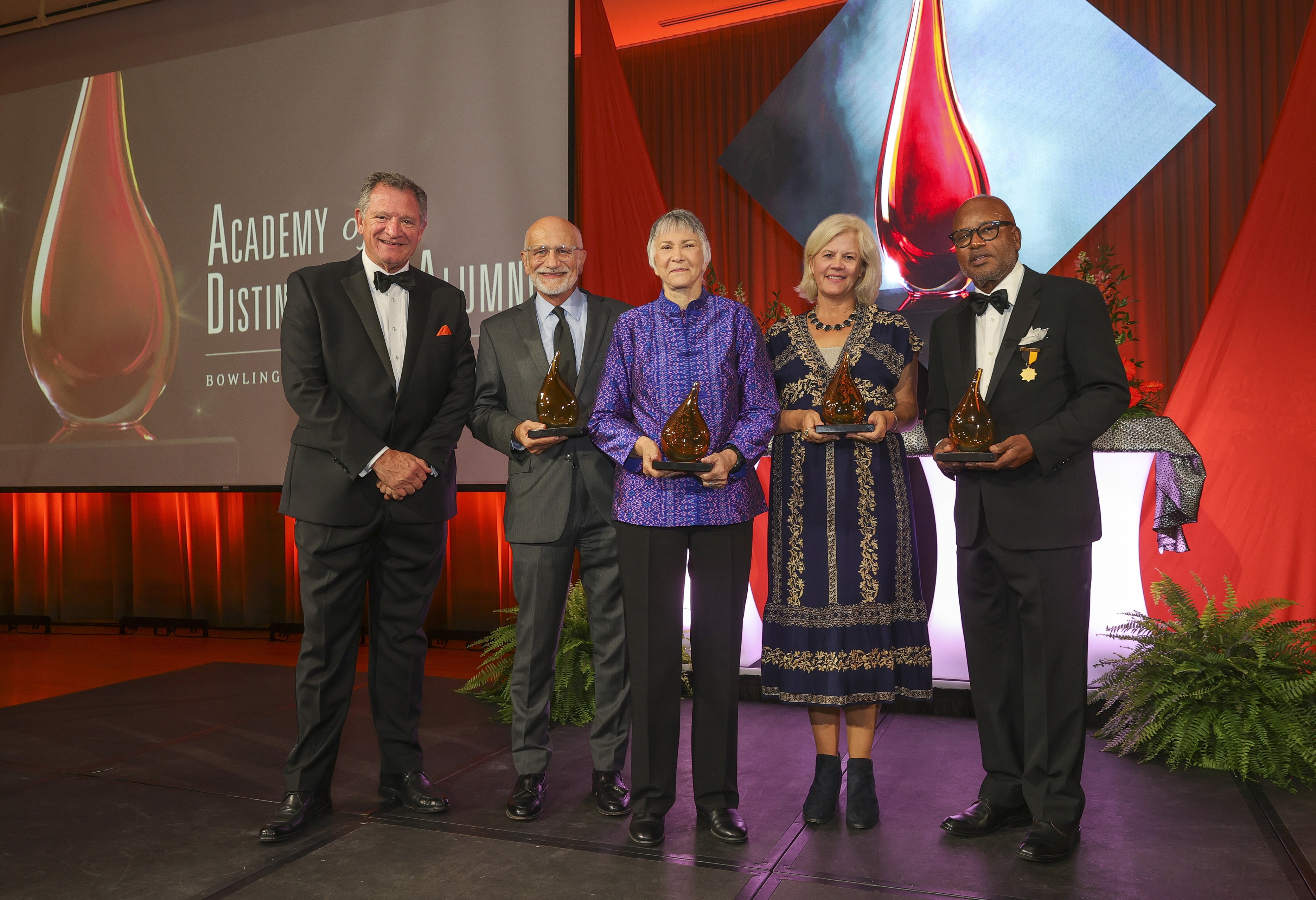 BGSU President Rodney K. Rogers poses with Academy of Distinguished Alumni inductees Dr. Anthony "Tony" Rucci, '72, '76, '78; Brenda J. Hollis, '68, '14 (Hon.); Beth Macy, '86; and Clarence Albert Daniels Jr., '71, '73. 