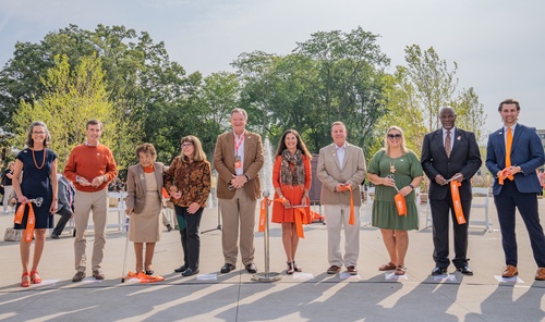 People stand in line after cutting the ribbon on the BGSU Alumni Gateway