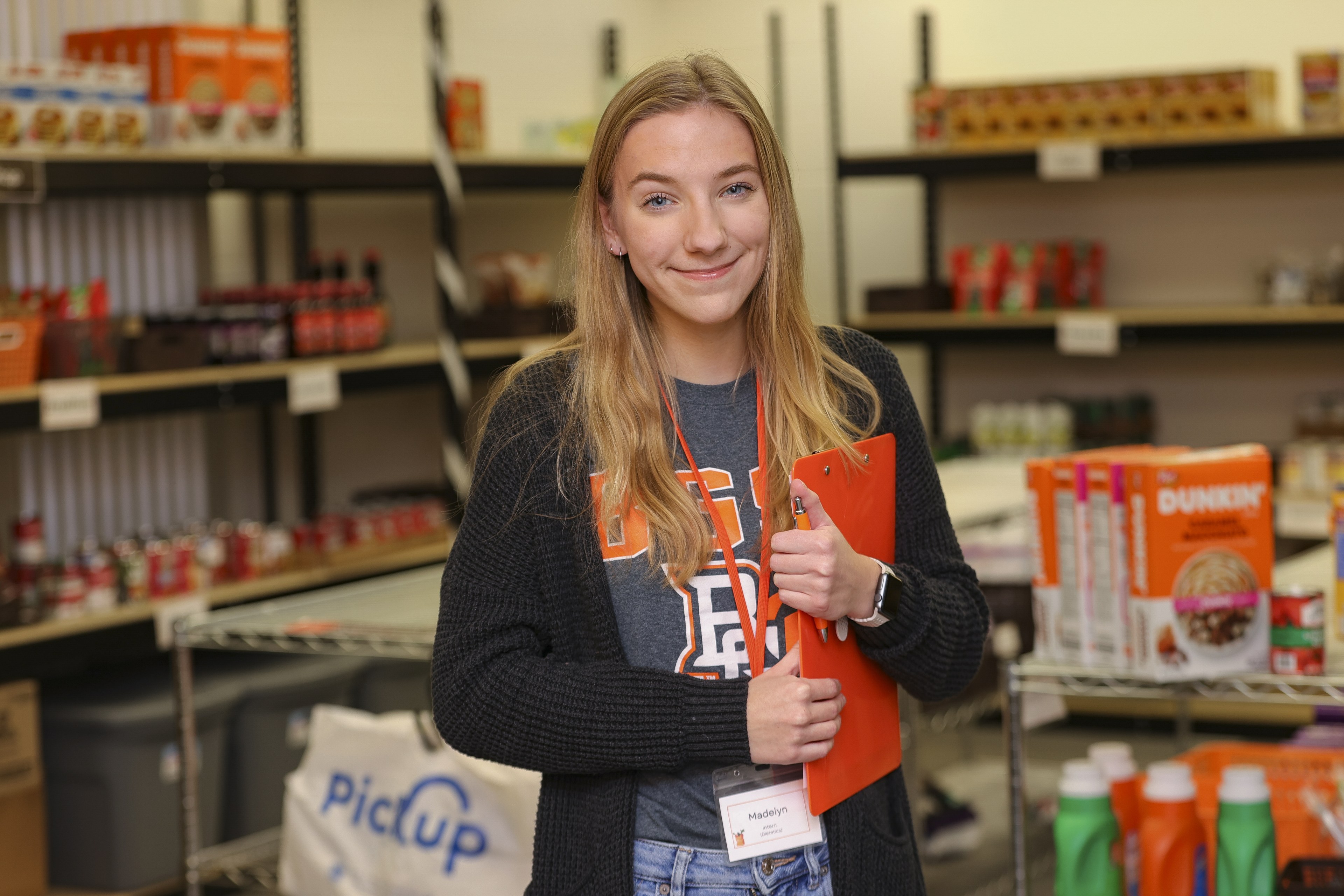Madelyn Huzyak smiling in the Falcon Food Pantry