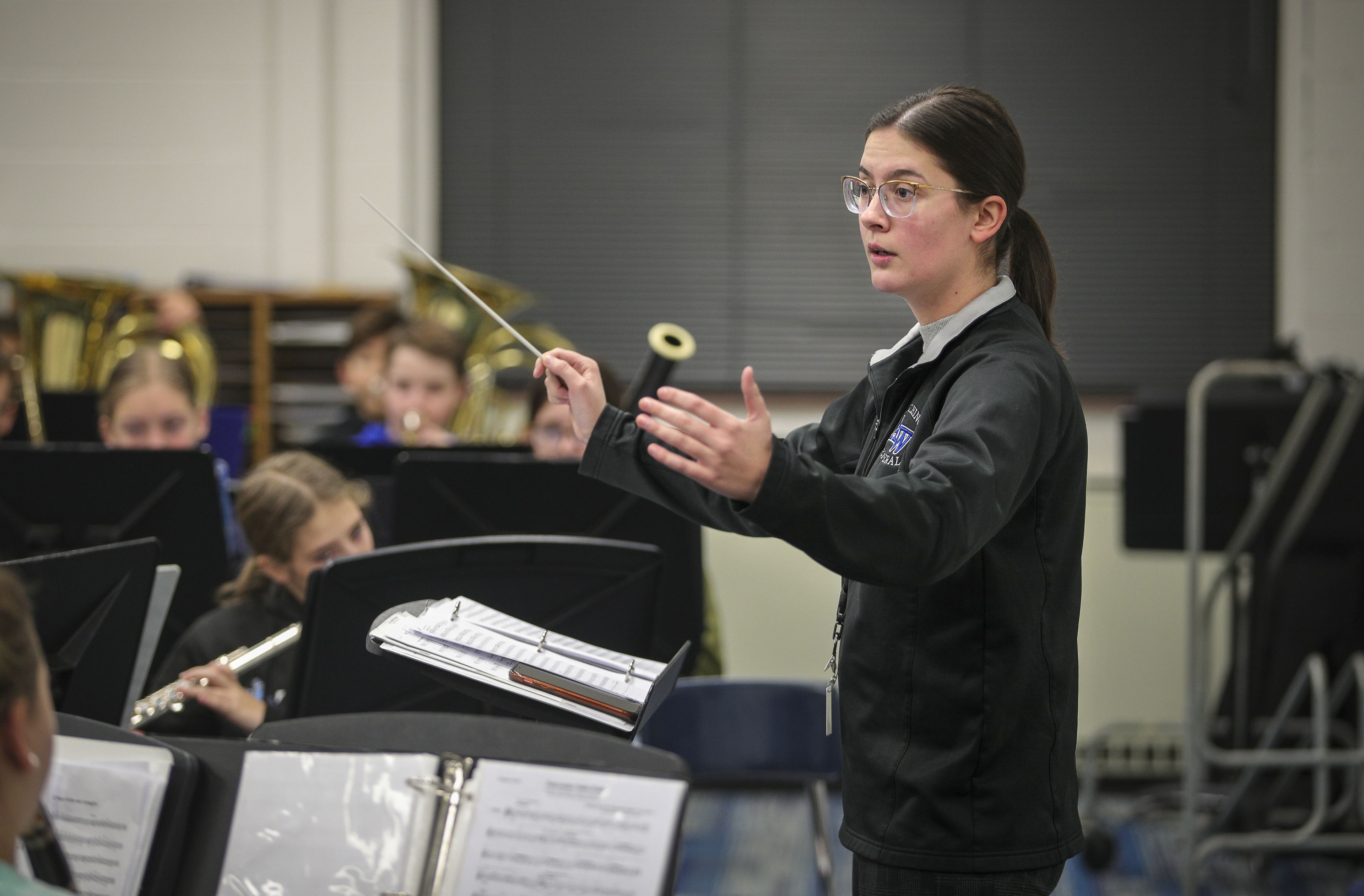 Lainie Roper directing students in band