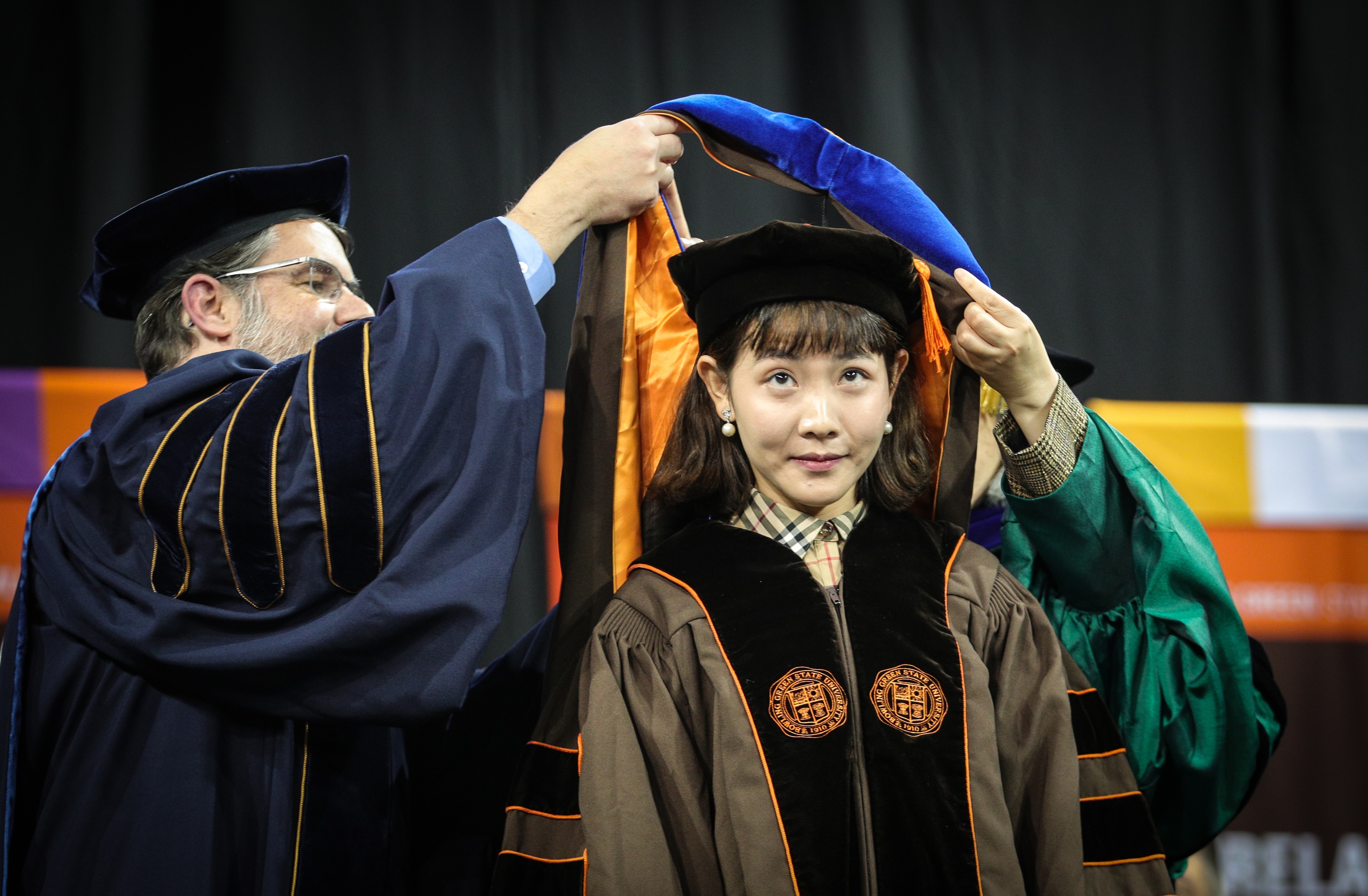 Graduate student receives her hood 