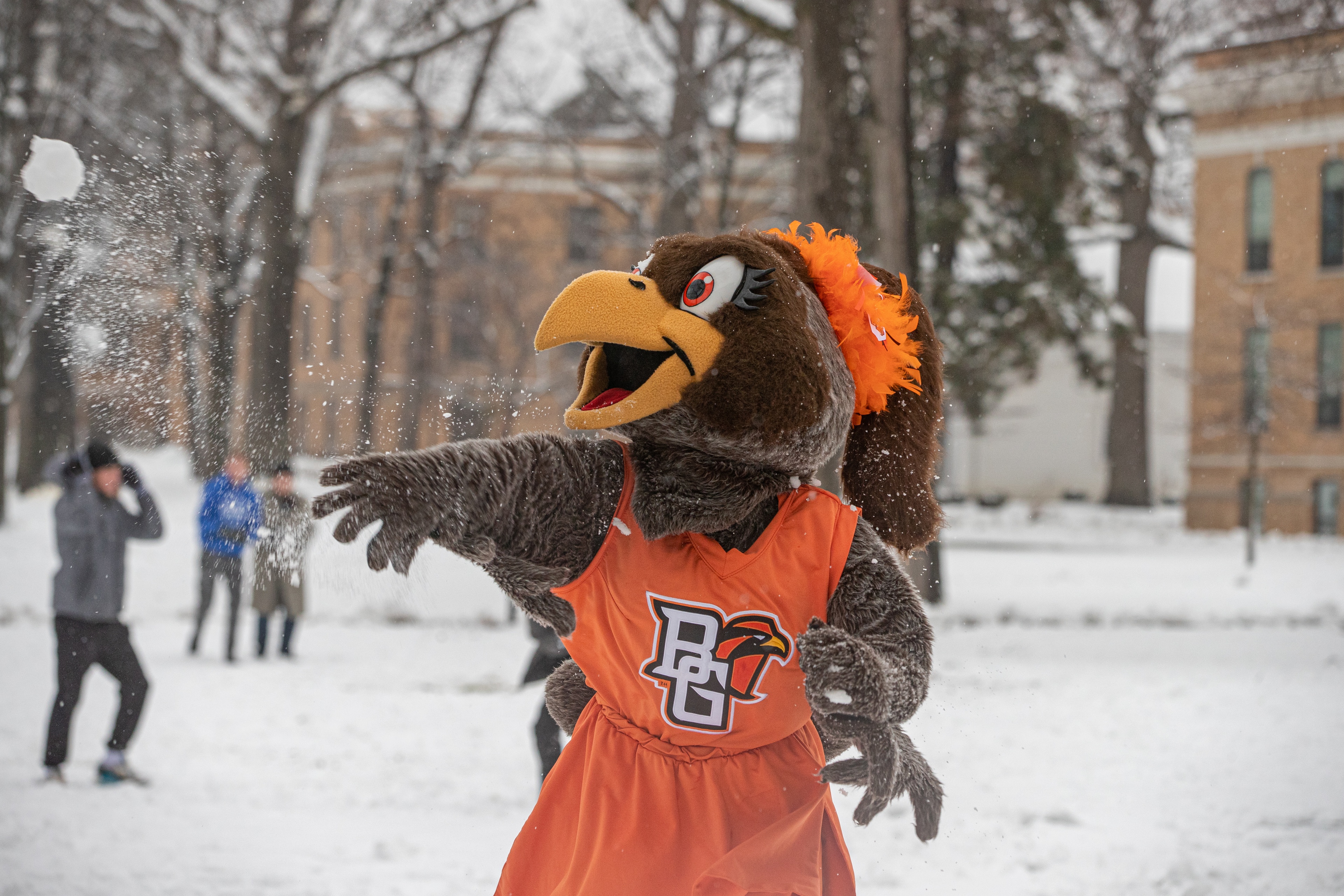 BGSU mascot Frieda Falcon throws a snowball