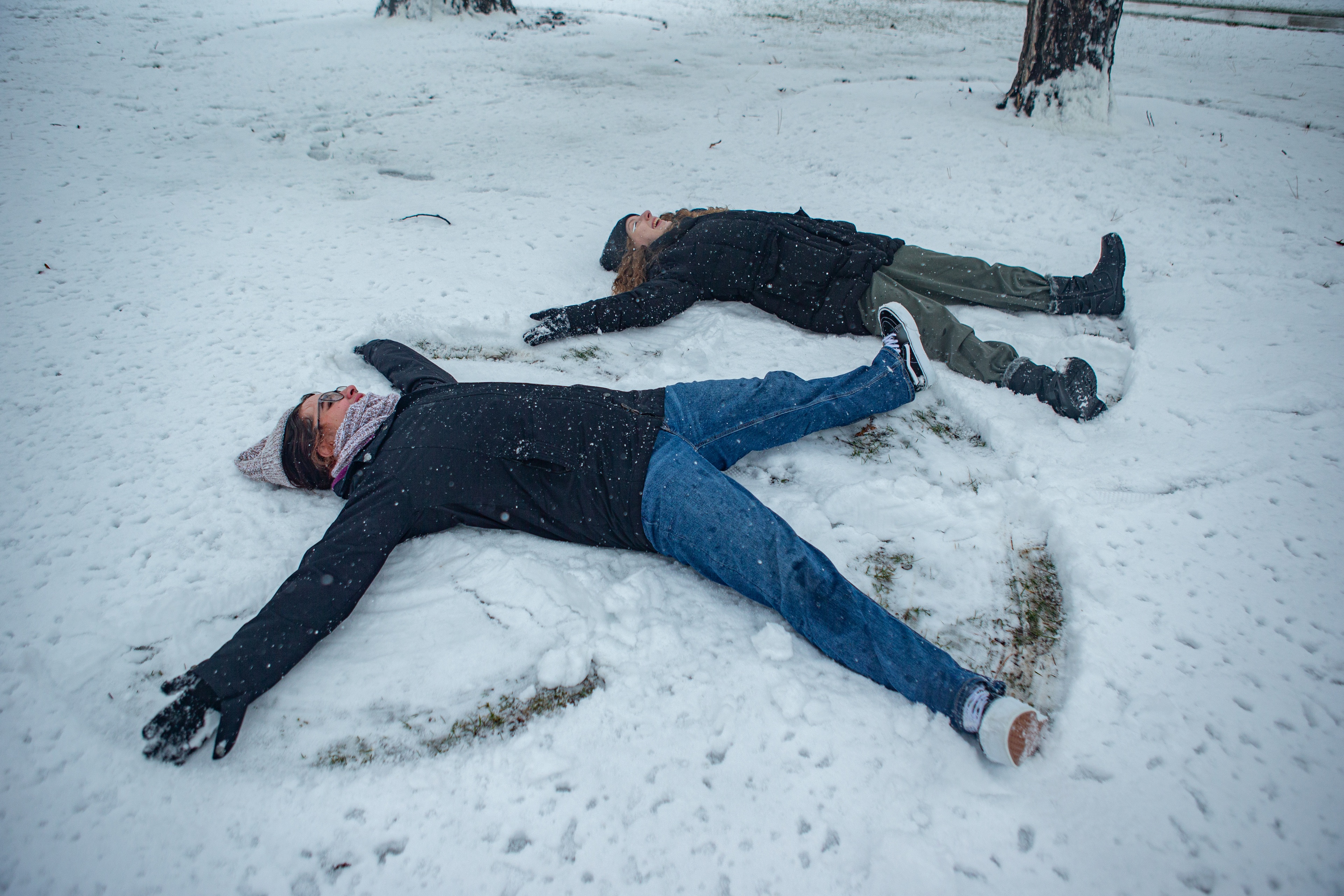 Two students make snow angels