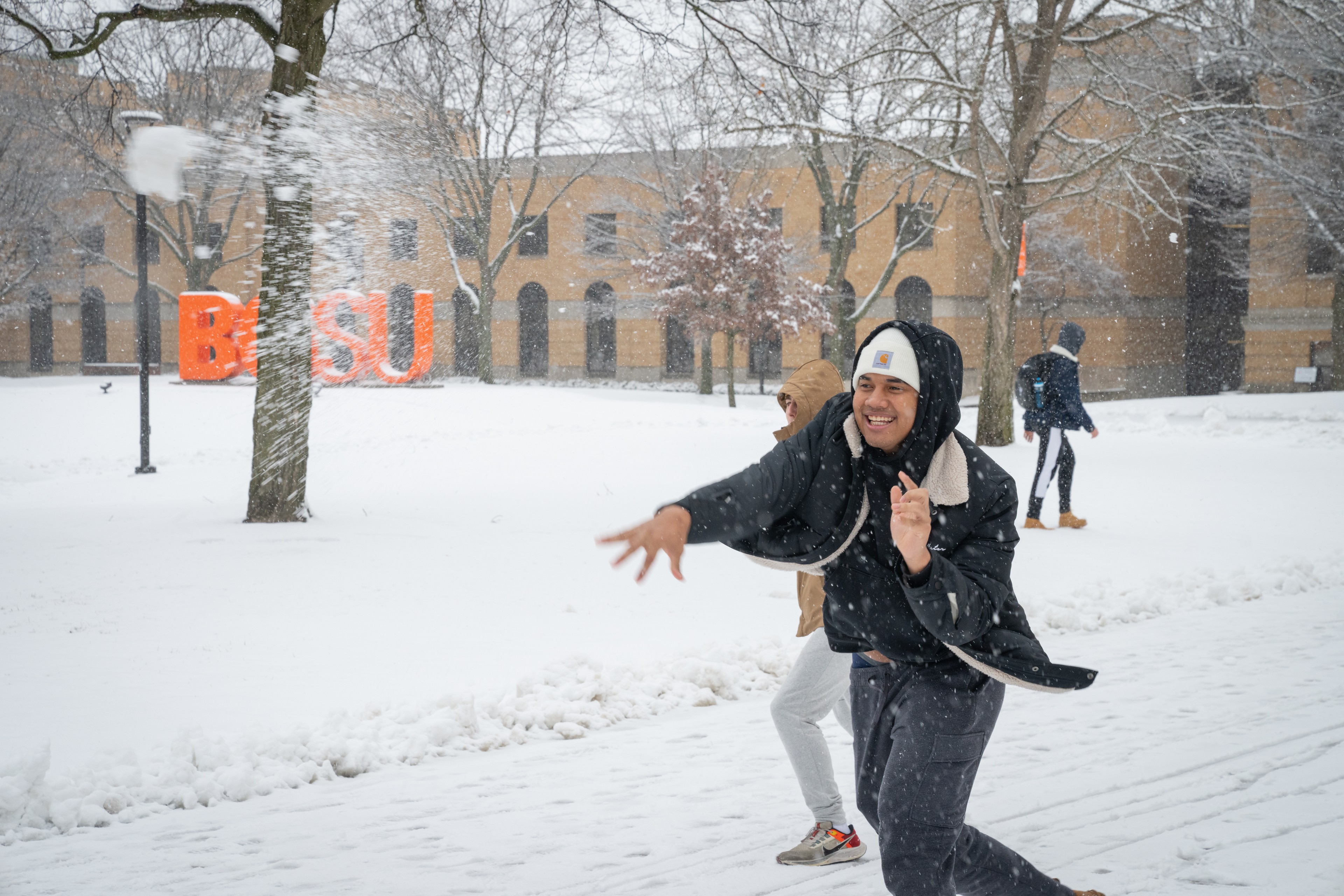 A student throws a snowball