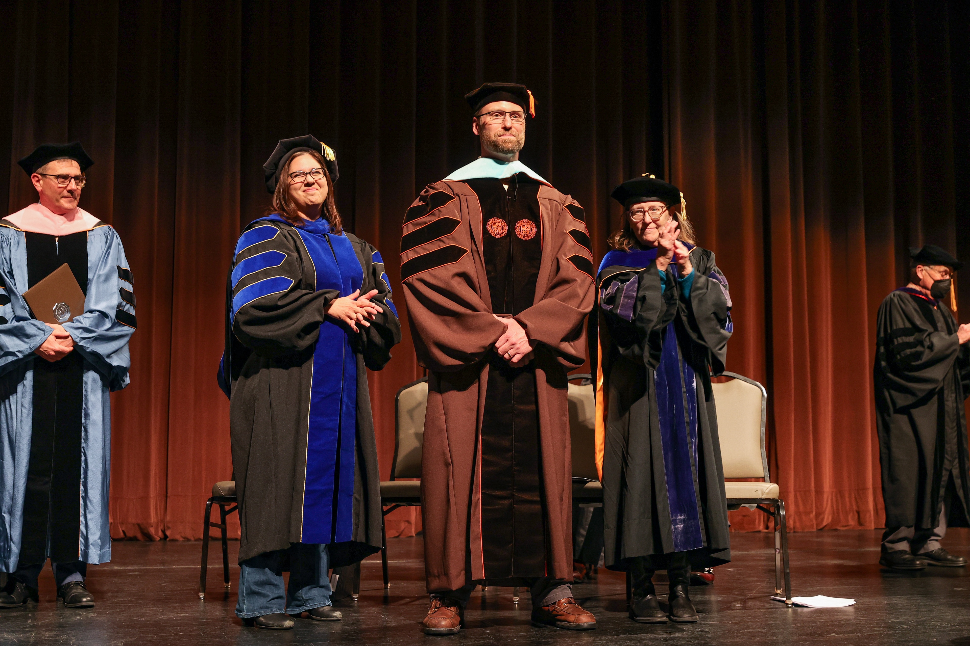 Doctoral candidate receives hood at hooding ceremony