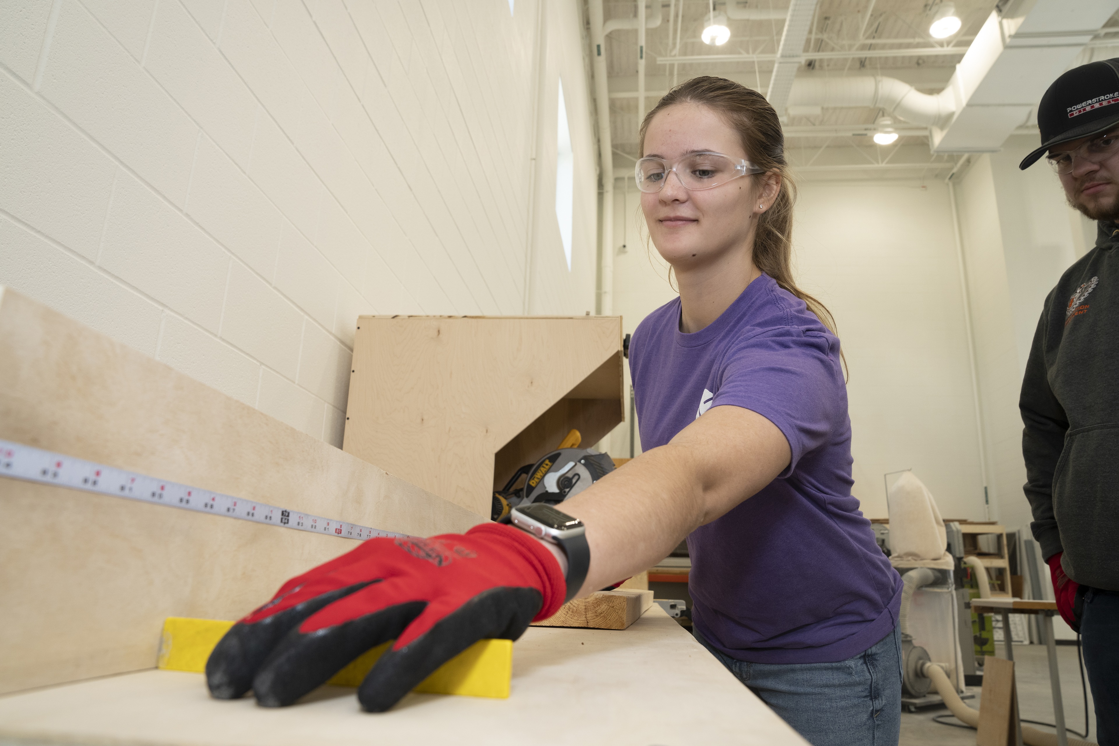 Two students work on a construction project at BGSU   