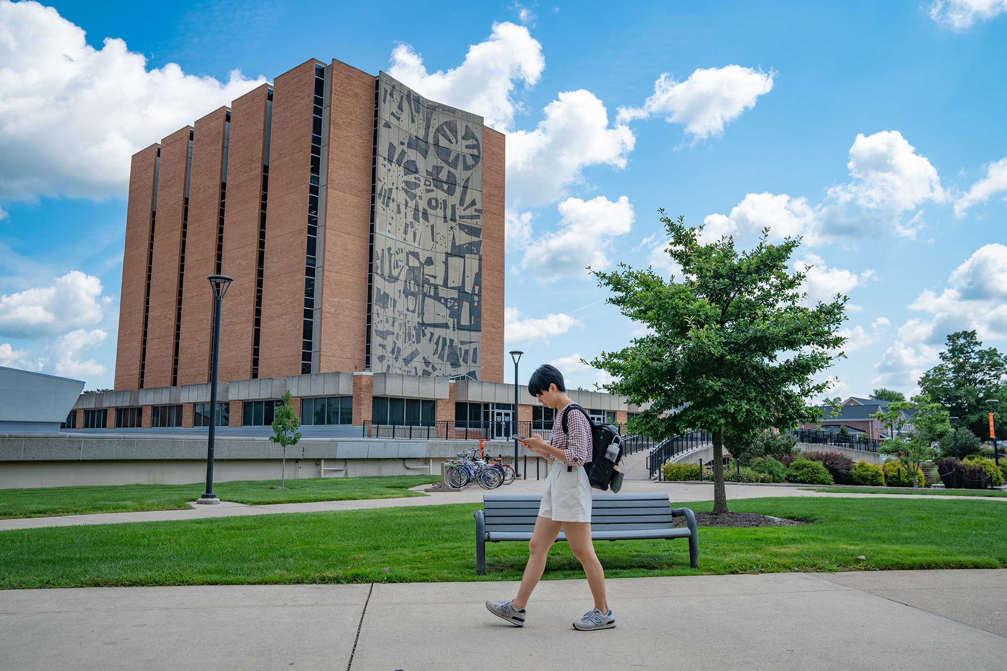 Student walks past Jerome Library on the BGSU campus