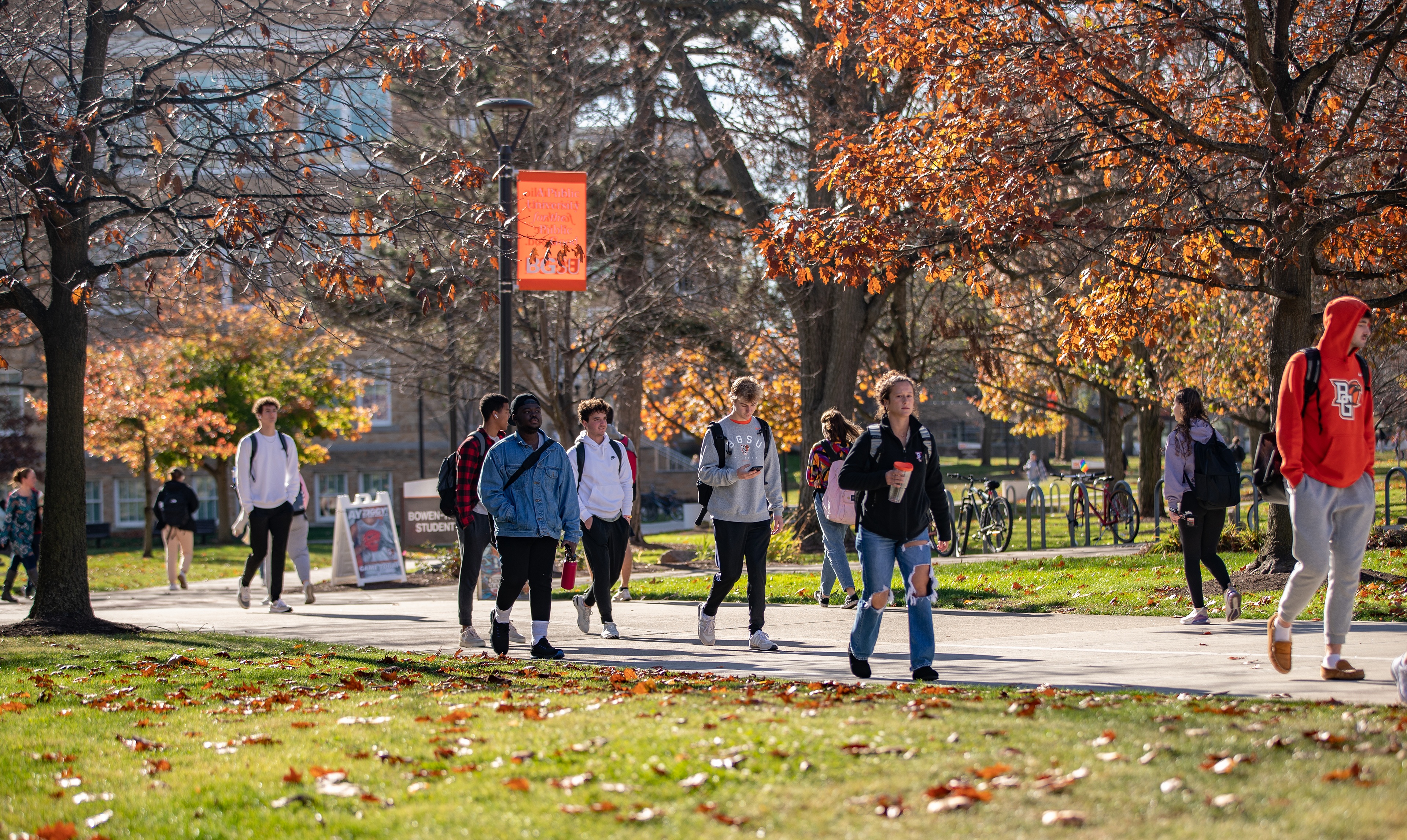 Group of students walking on campus during fall