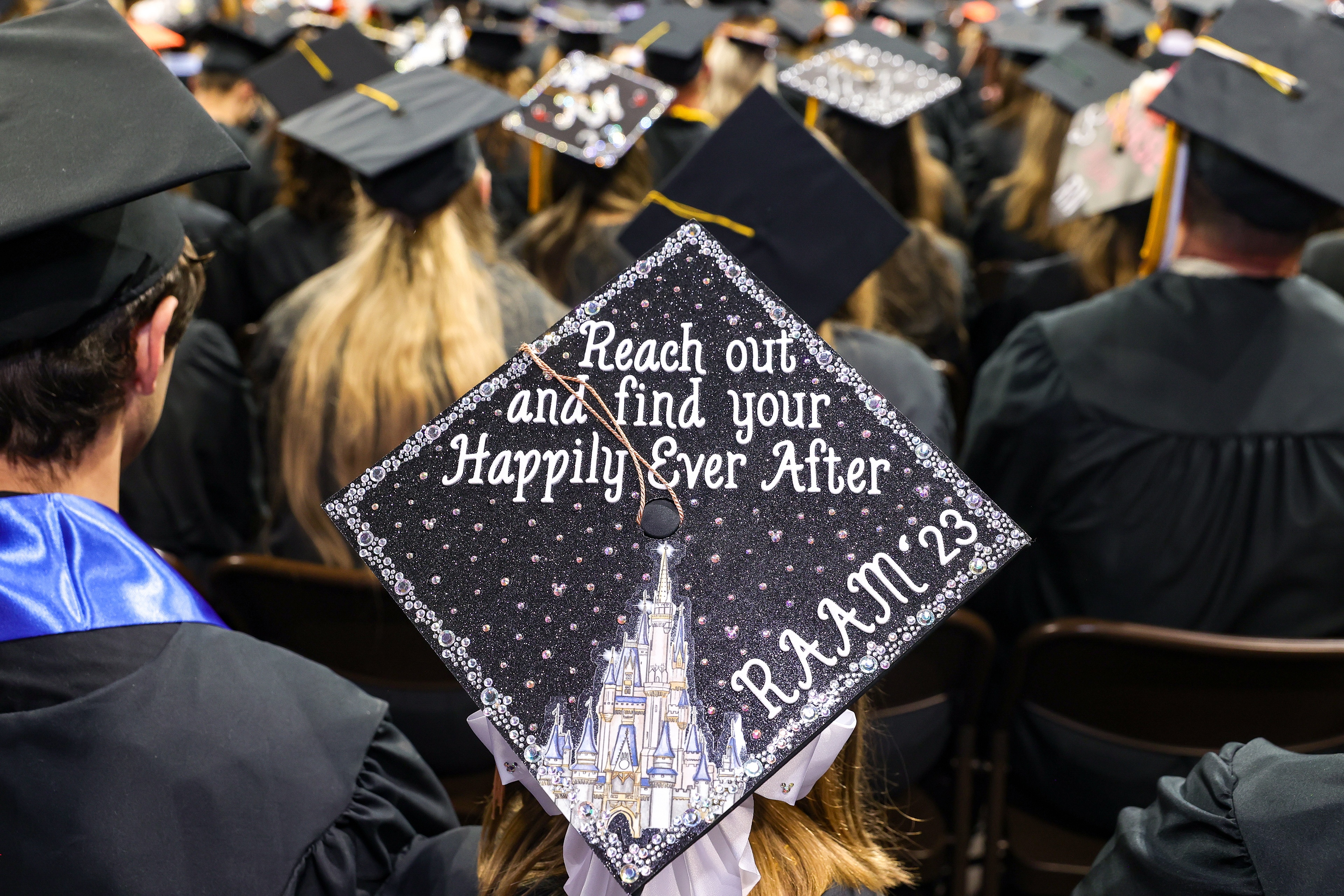 Graduation cap says, “Reach out and find your Happily Ever After / RAAM ’23”