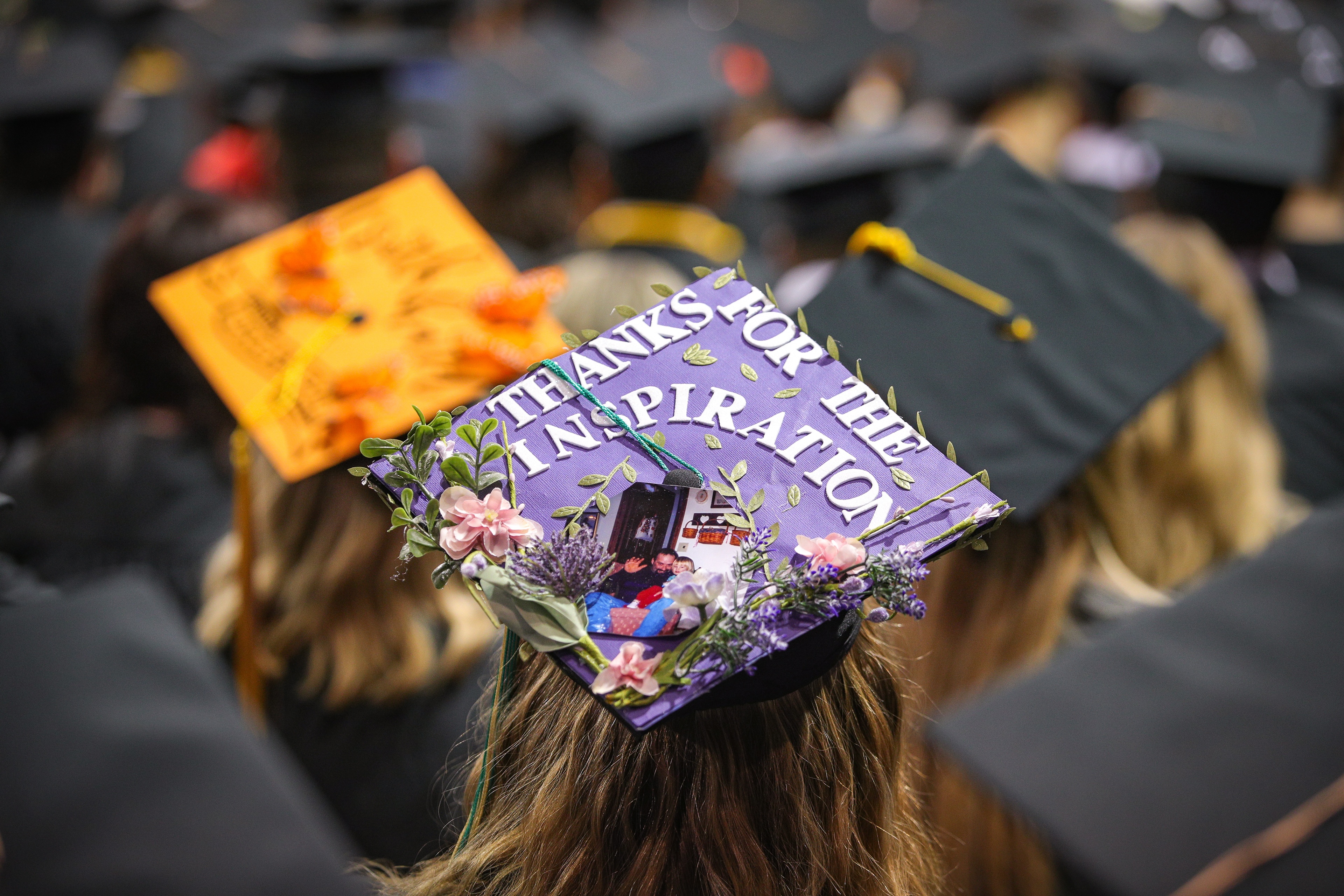 Graduation cap says, “Thanks for the inspiration” with photo of dad and daughter
