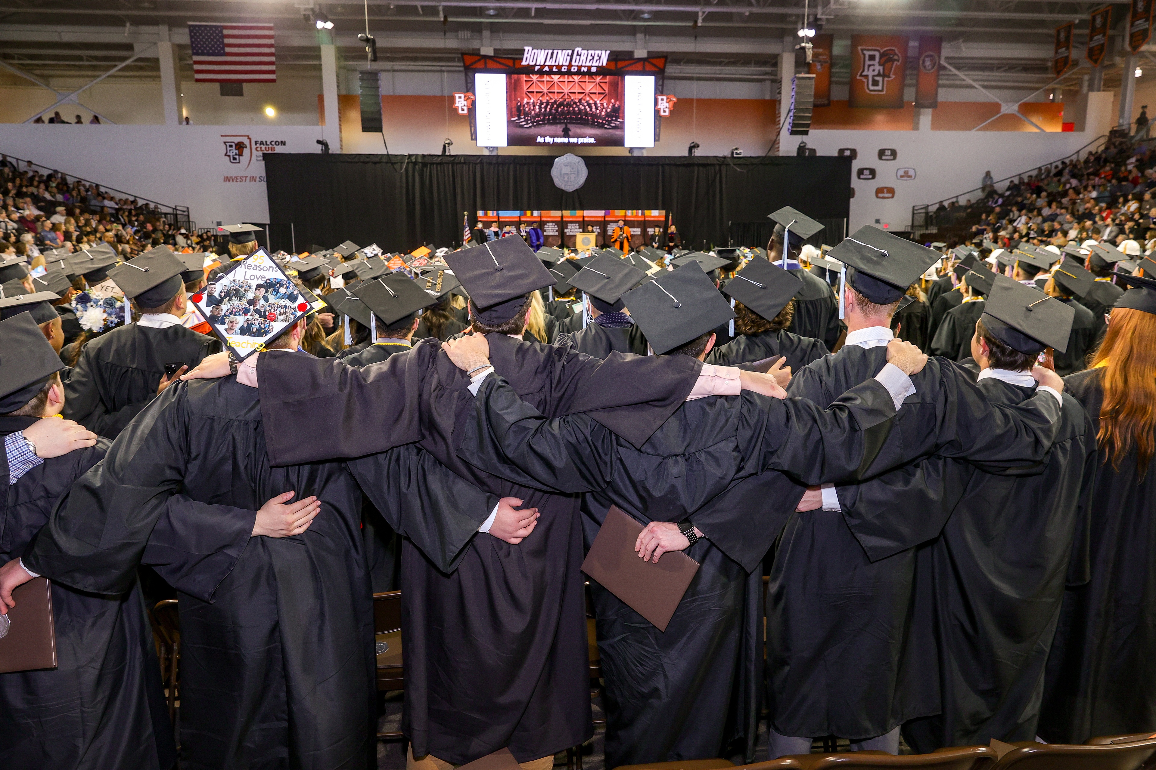 BGSU graduates stand arm in arm to sing alma mater 
