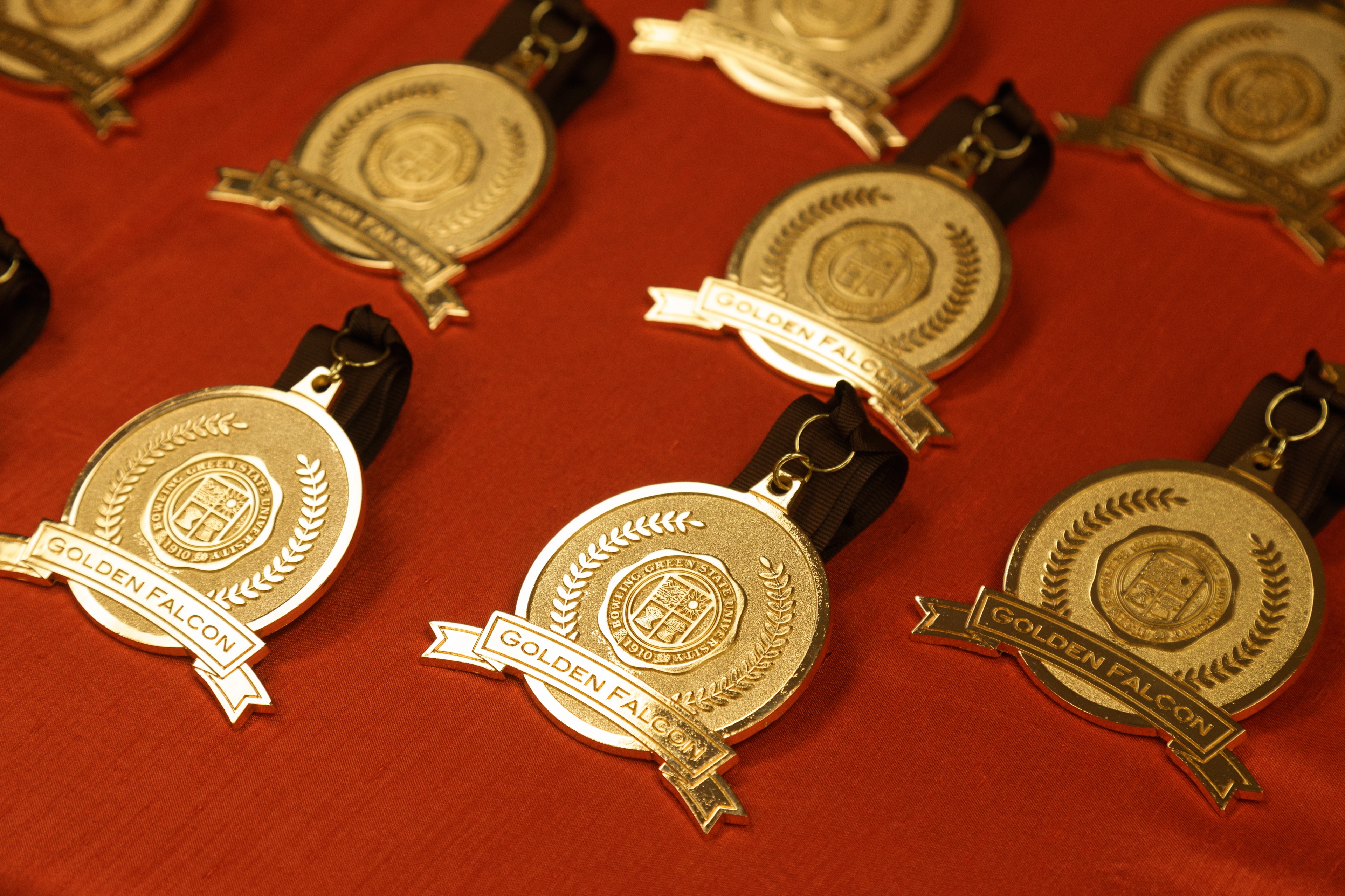 Golden Falcon medallions lay on a table