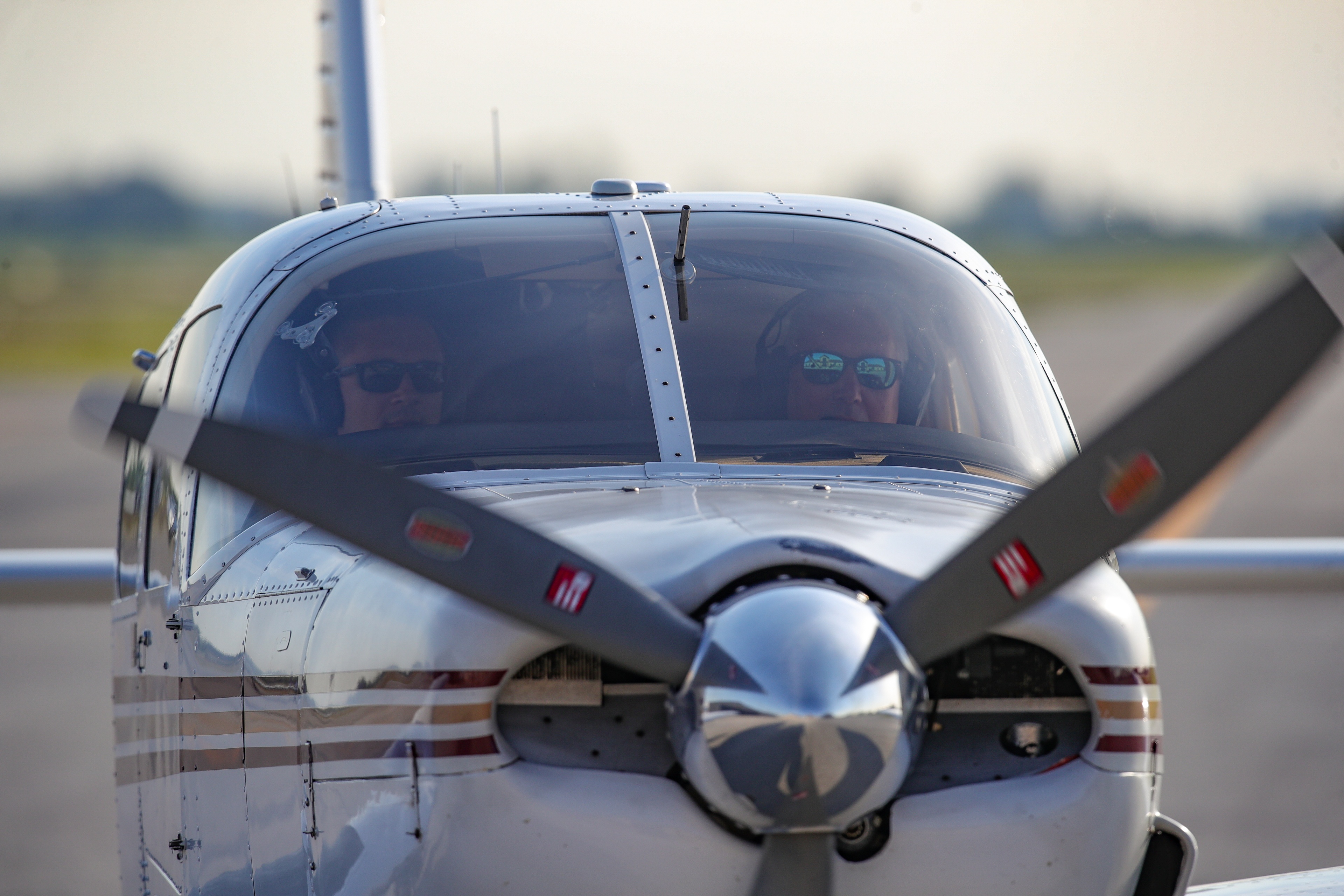 Two men piloting an airplane