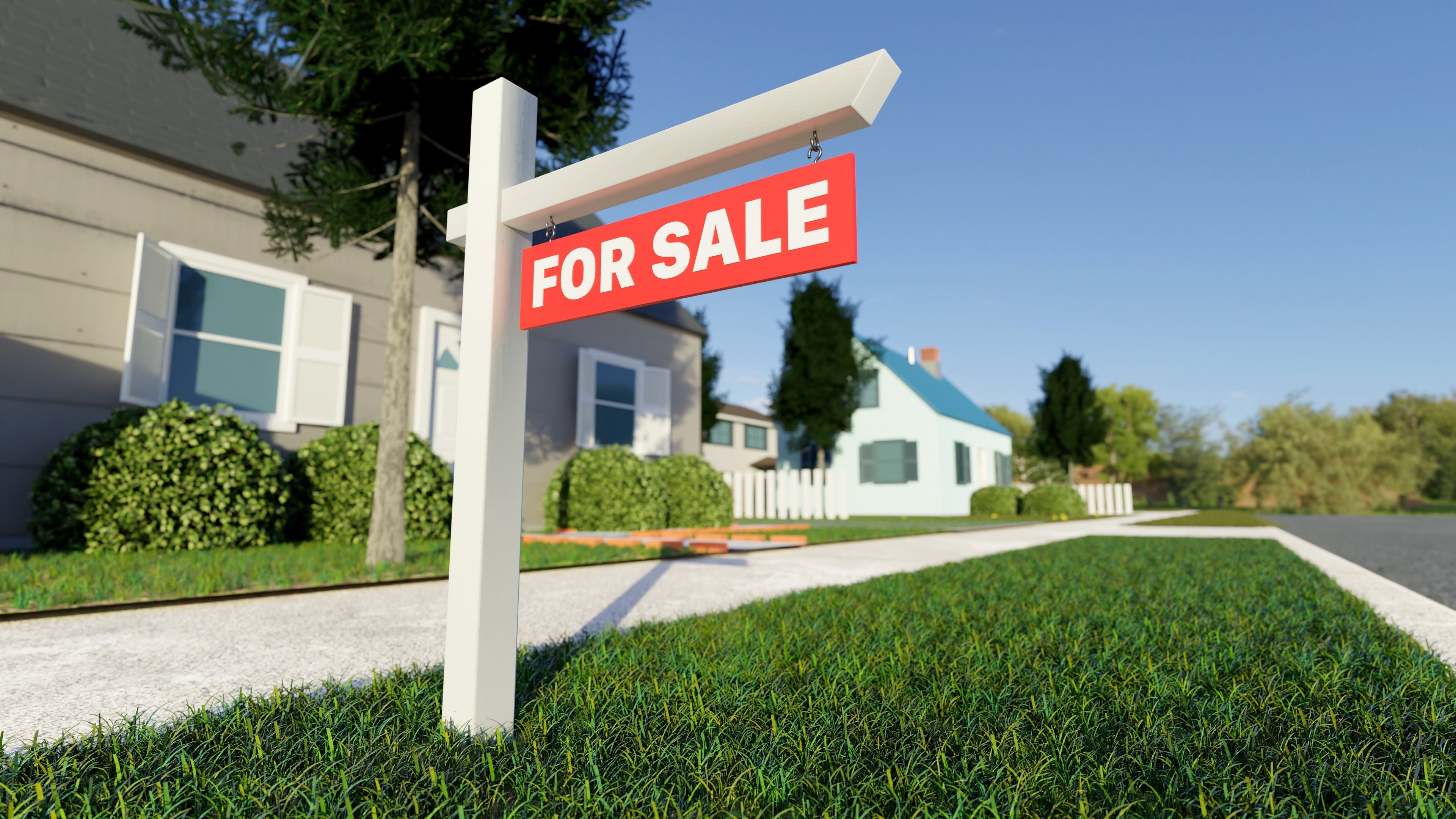 Real estate sign in front of a house for sale