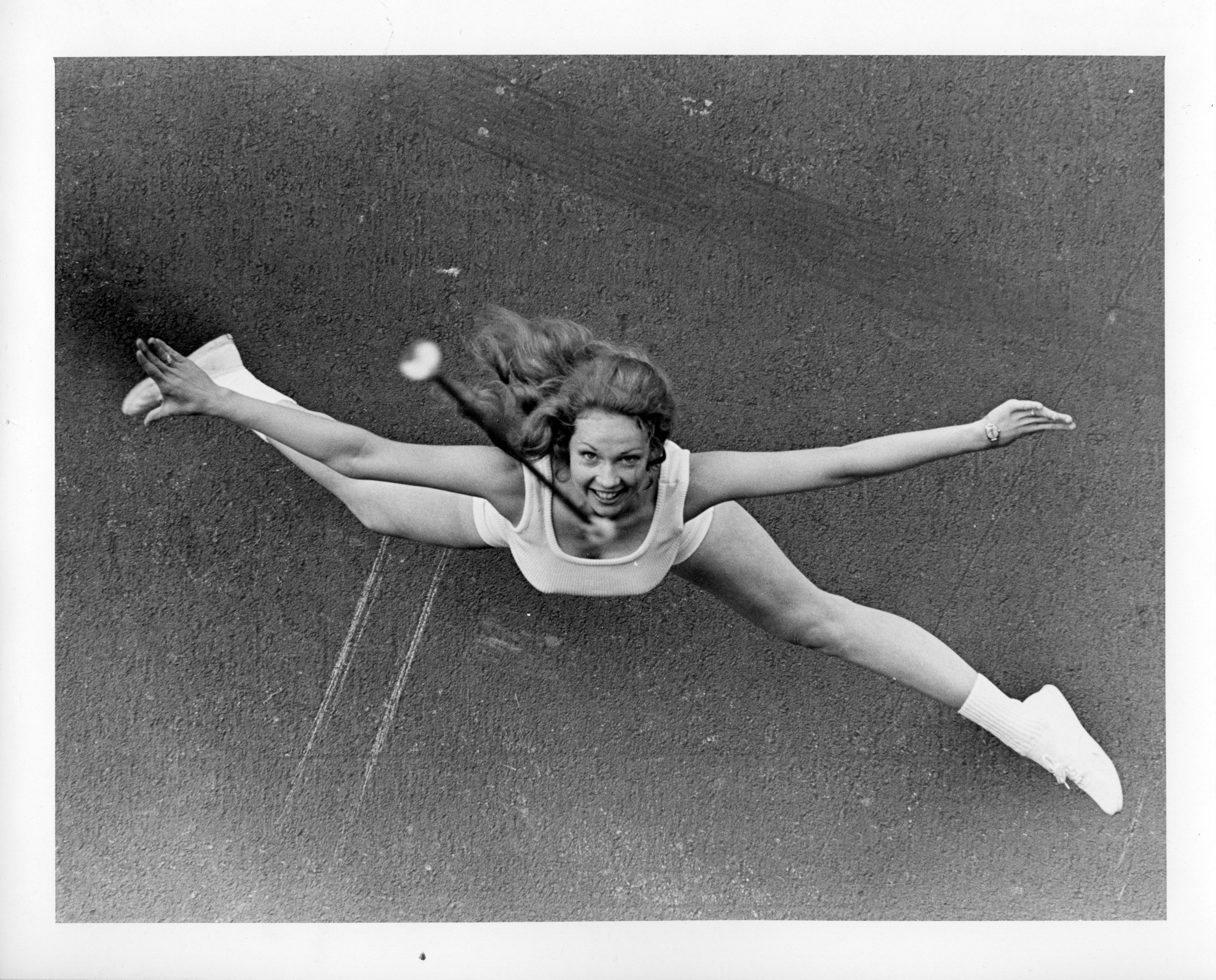 Top-down photo of a majorette during baton practice in 1973