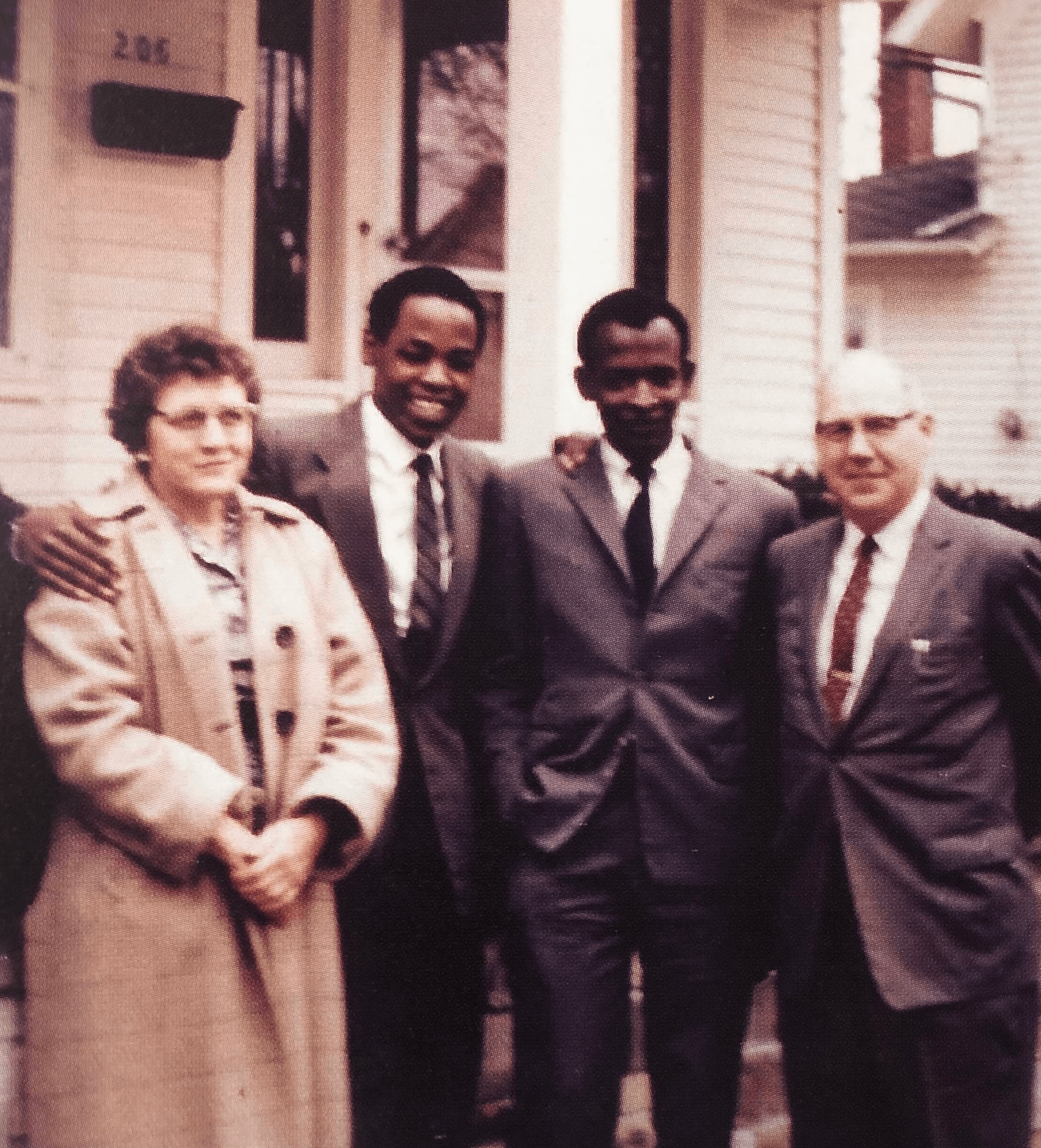 Dorothy Hamilton, James Karugu, an unknown man, and Dr. Ernest Hamilton stand outside a house in the early 1960s in Bowling Green.