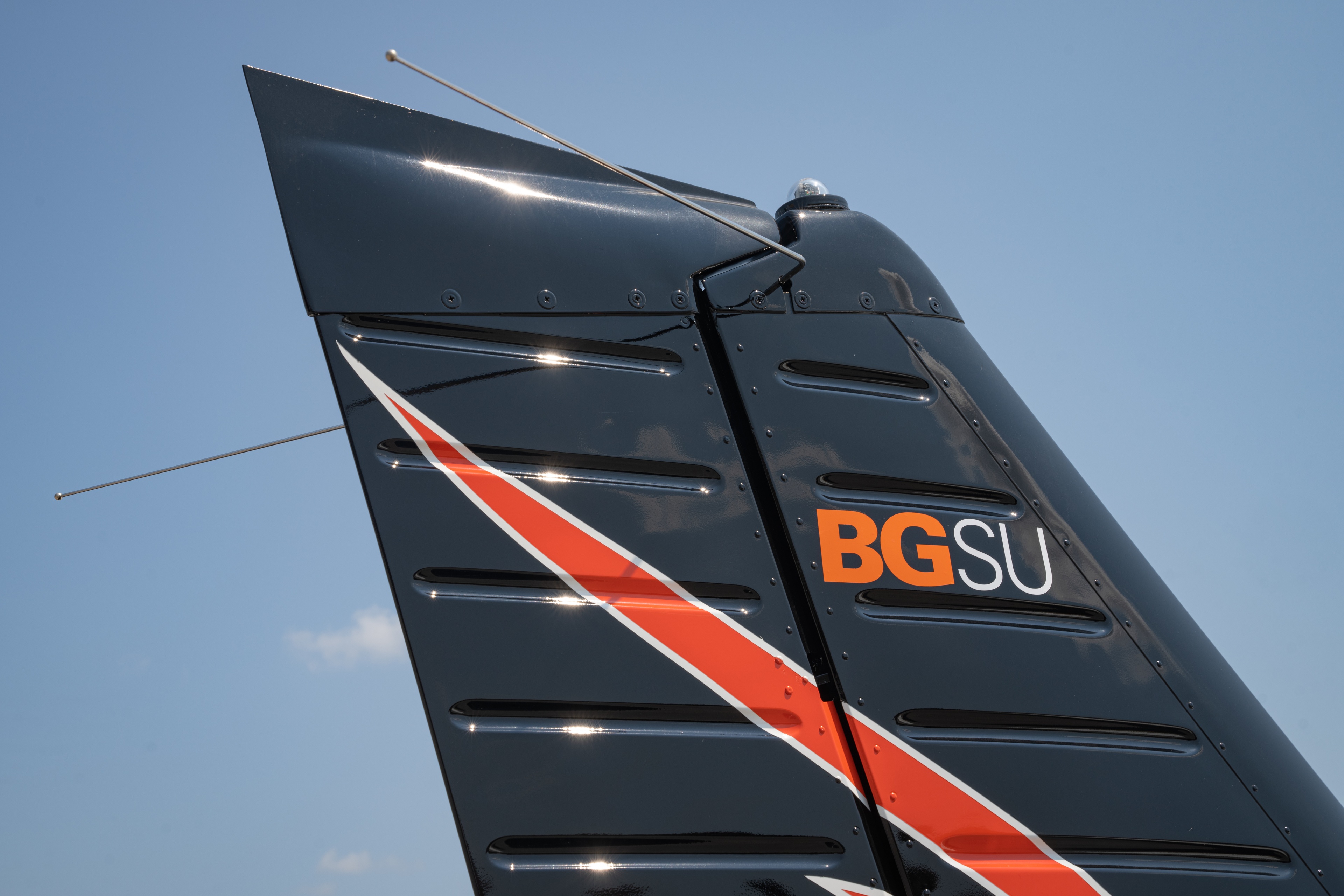 Close-up of an airplane tail with a BGSU logo