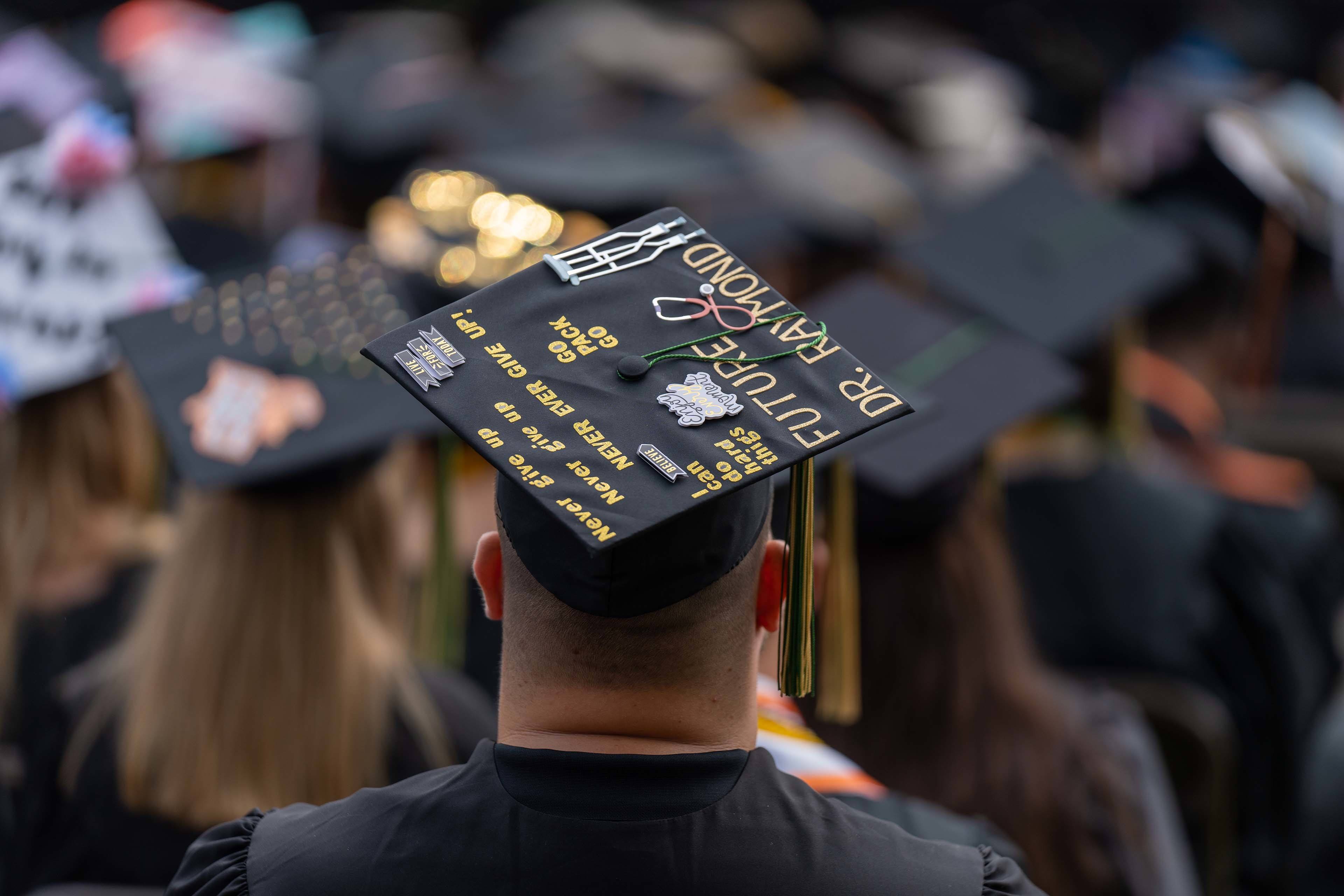 Graduation cap says, "Future Dr. Raymond" 