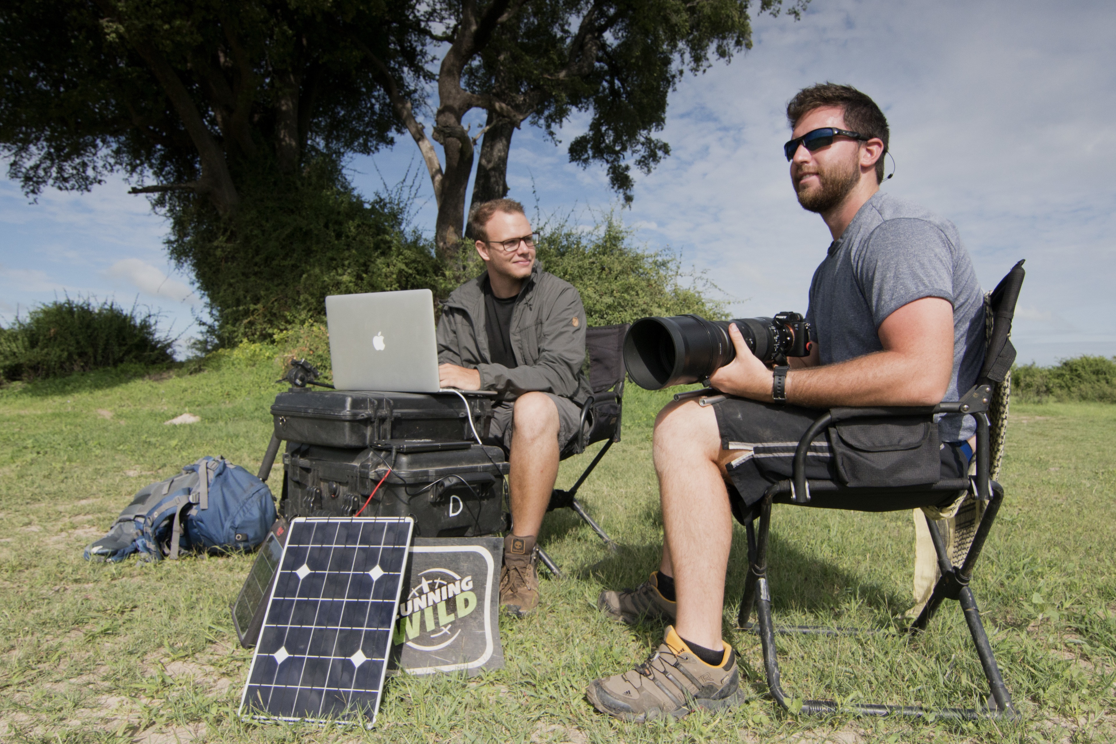 Two men in Botswana with their video production equipment.