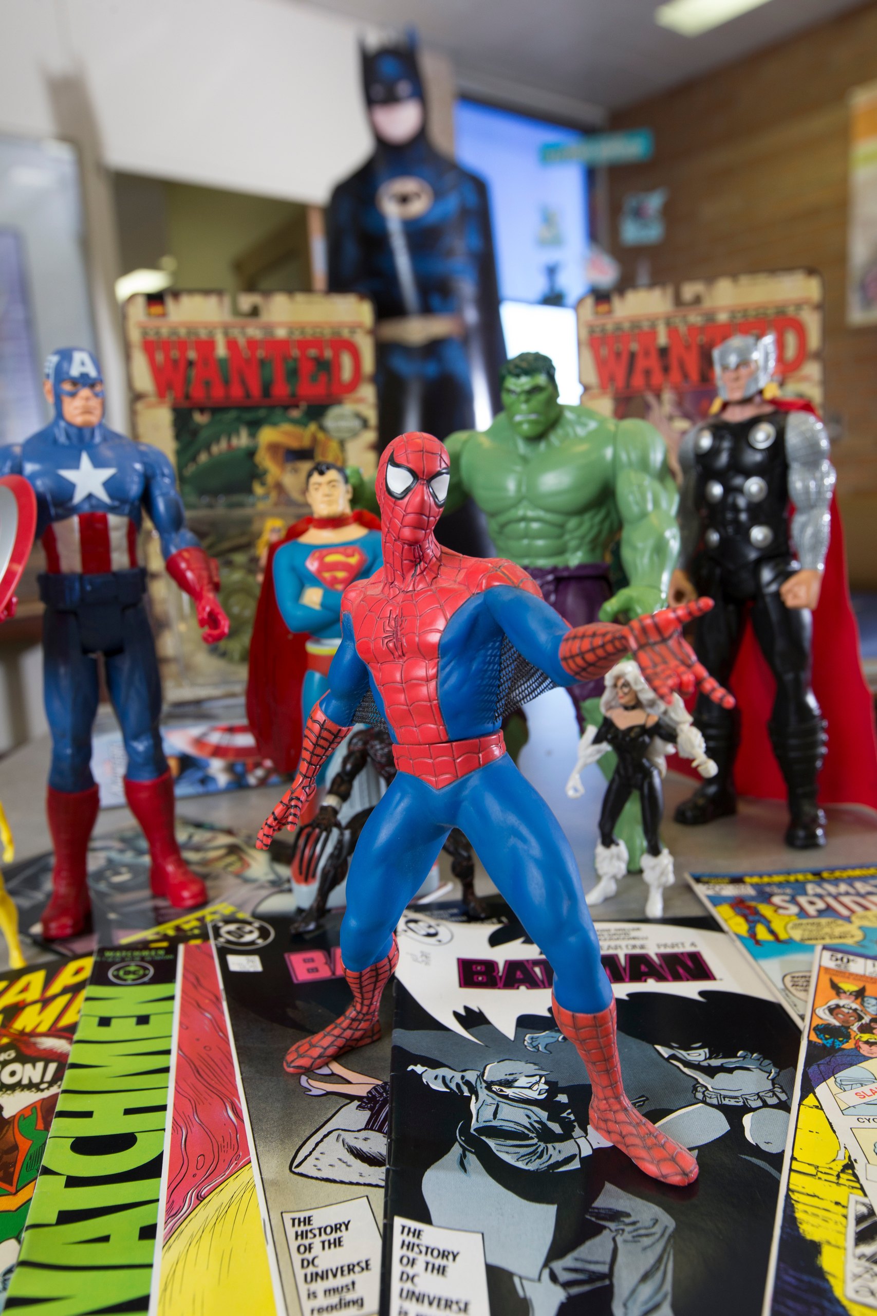 A Spider-Man figure stands in front of other action figures inside the Browne Pop Culture Library at BGSU. 