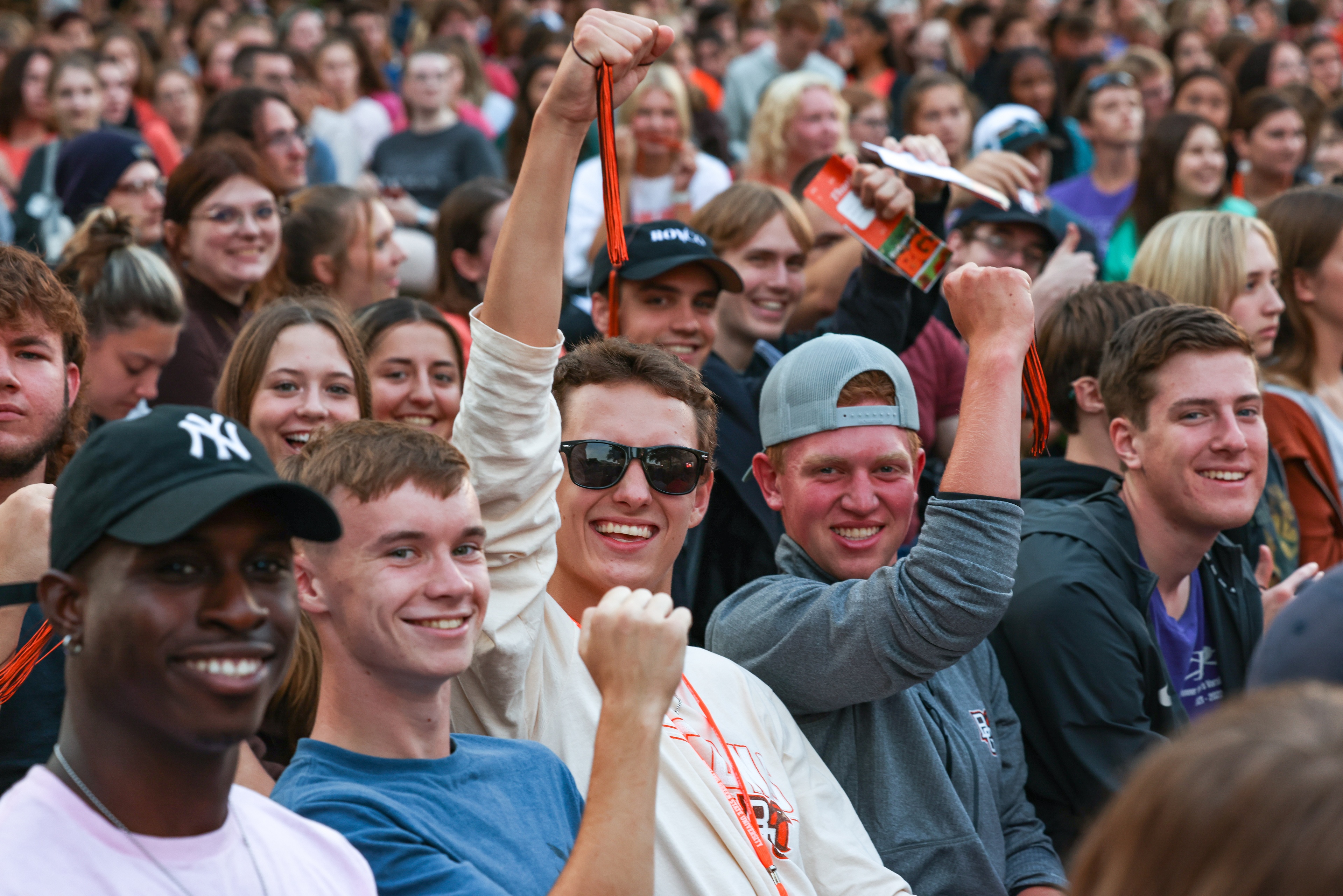 Students smile while attending BGSU Convocation.