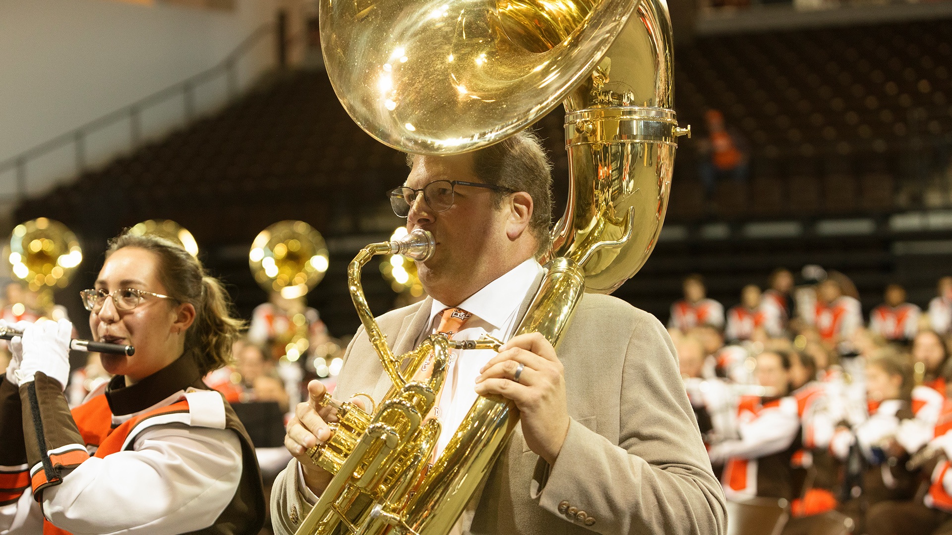 Falcon Marching Band Director Jon Waters plays a sousaphone