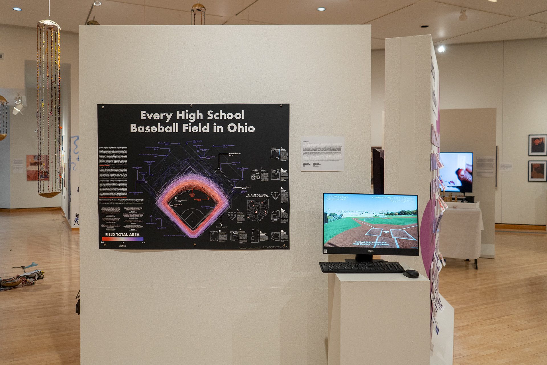 An overlay graphic of every high school baseball field in Ohio is presented in an art gallery.