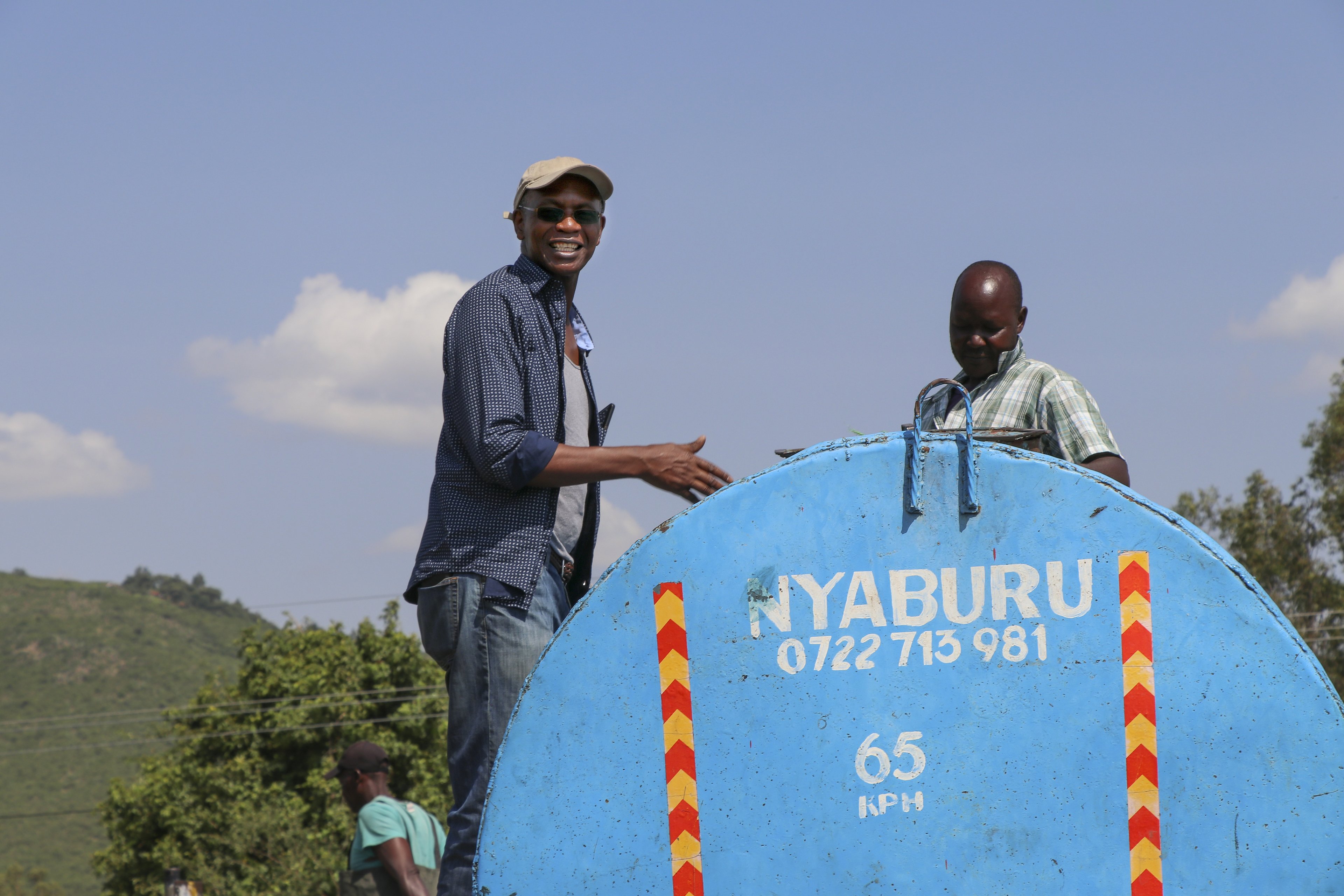 Dr. Kefa Otiso smiles on a research trip to Kenya to study algal blooms on Lake Victoria.