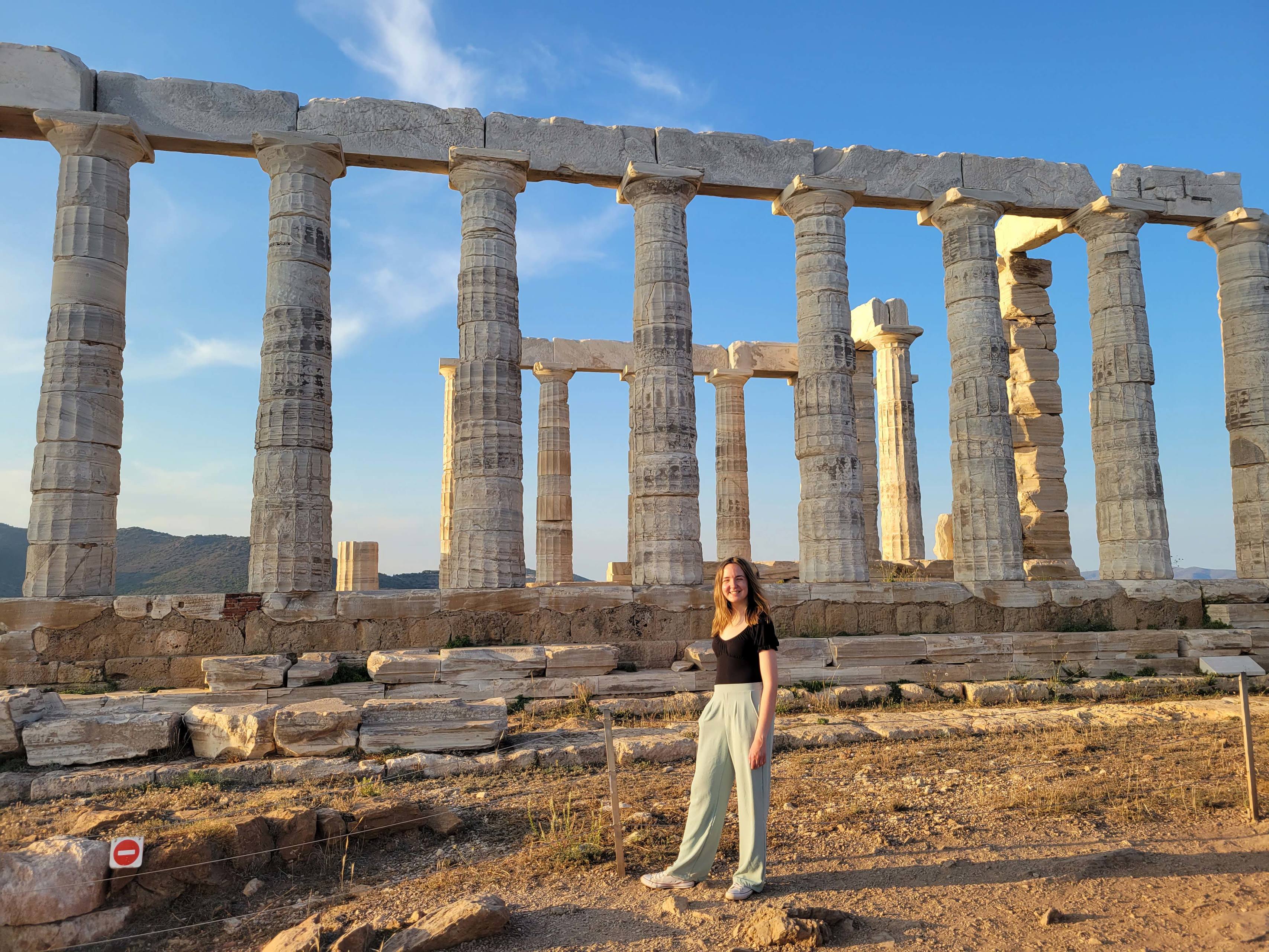 A BGSU student stands in front of the Parthenon in Greece.