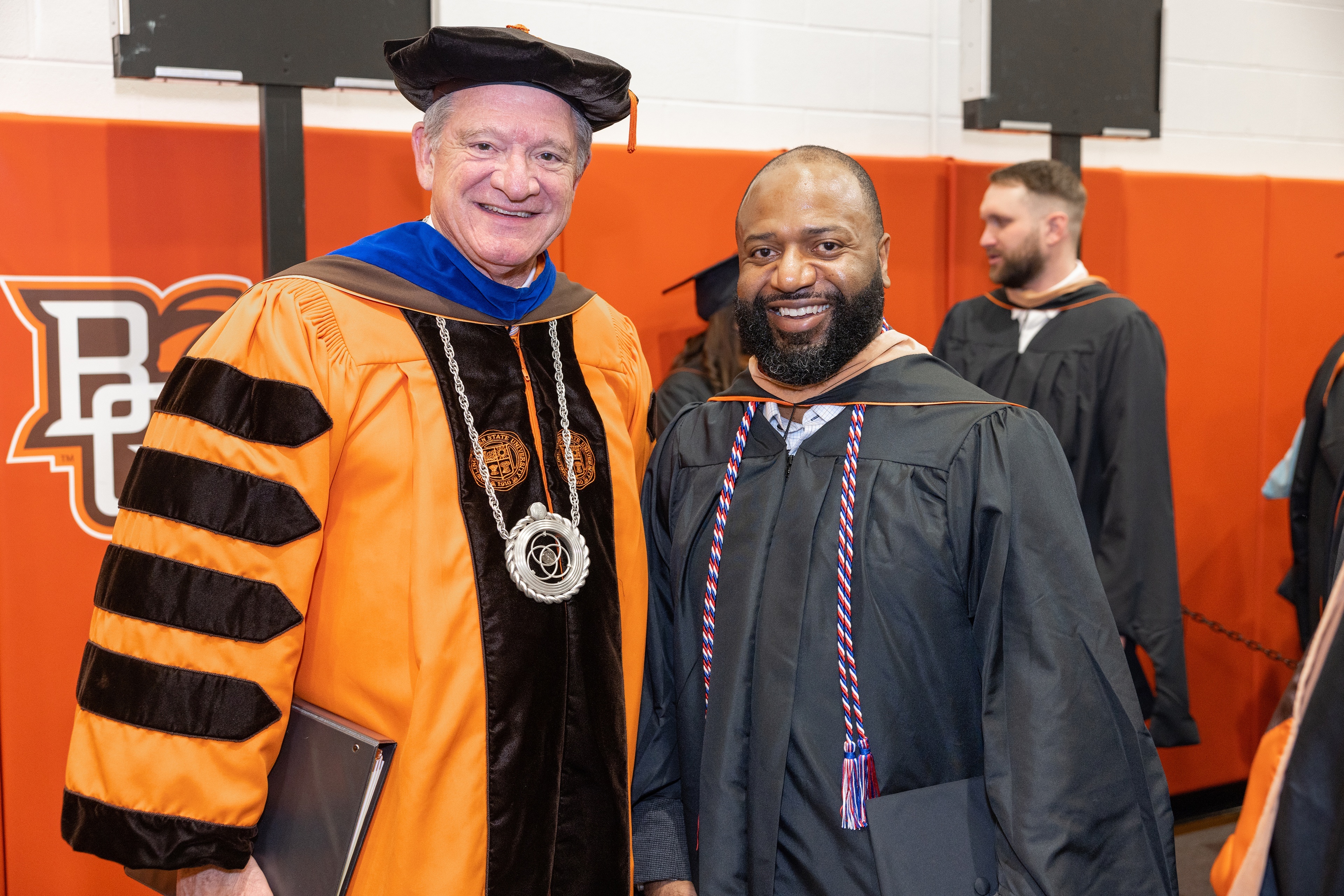 President Rogers and alumnus Jeff Bivens stand together for a photo at Fall 2023 Commencement