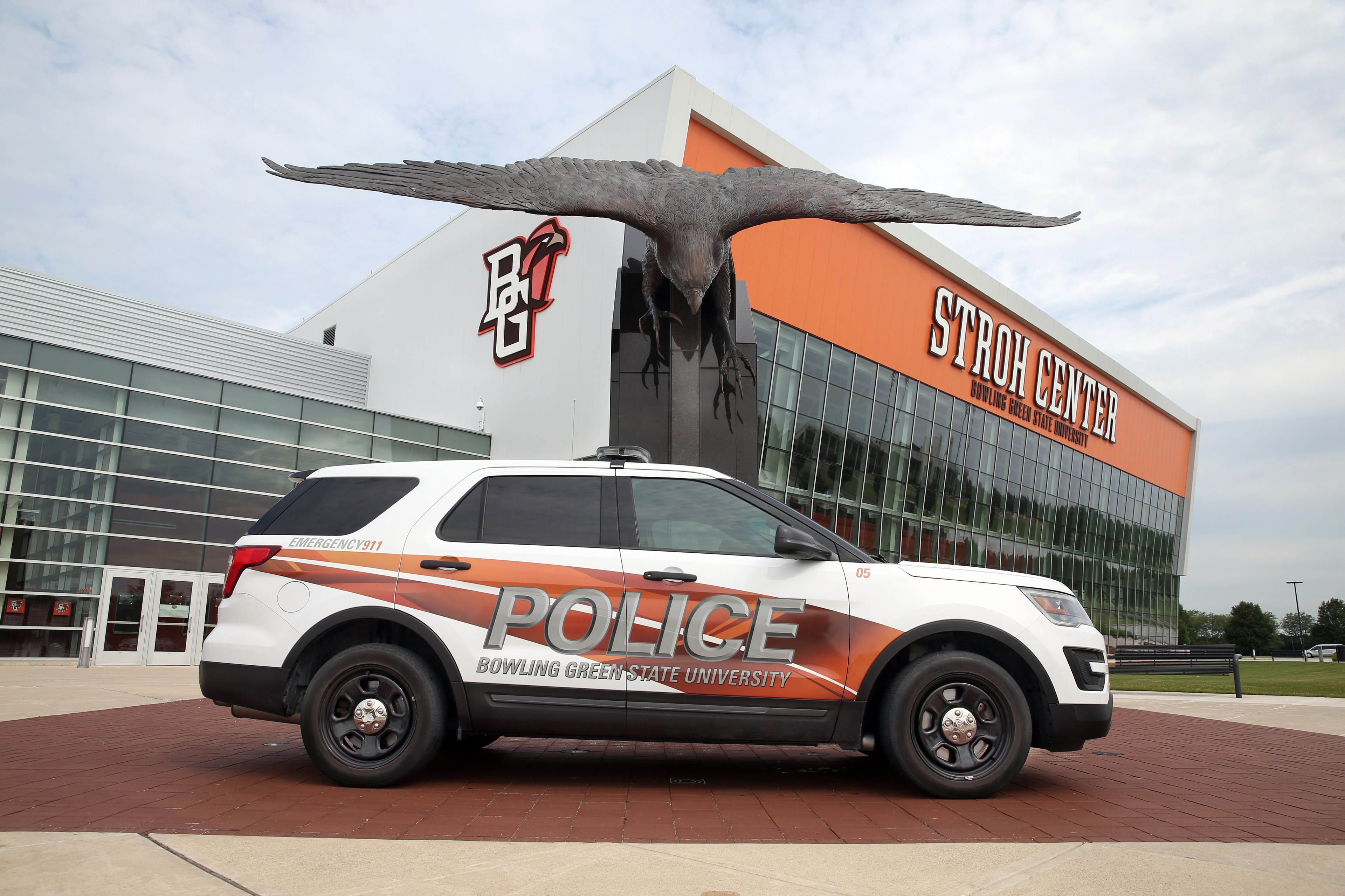 A BGSU police cruiser sits parked outside the Stroh Center on the Bowling Green campus.