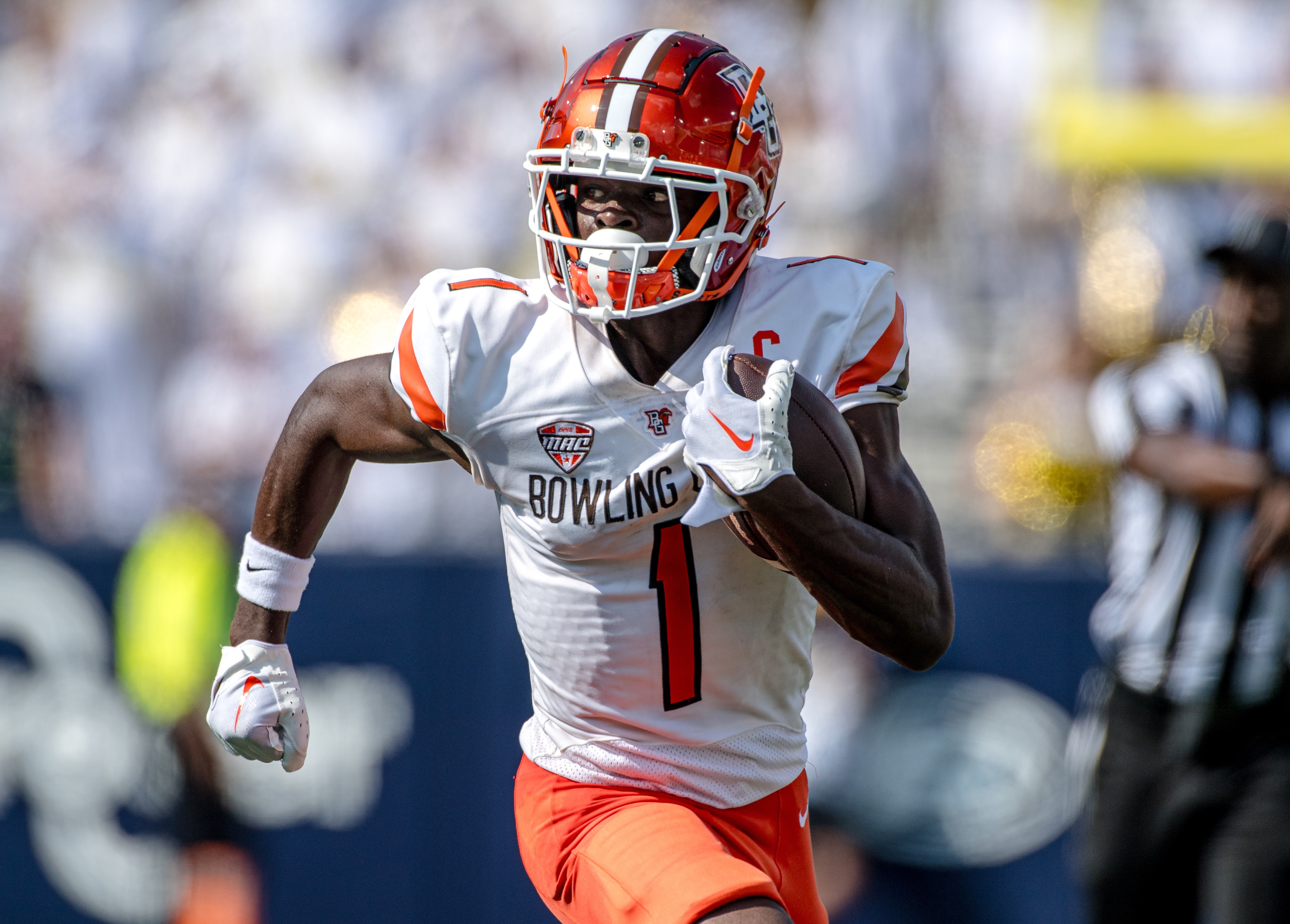 BGSU wide receiver Odieu Hiliare carries the football during a game