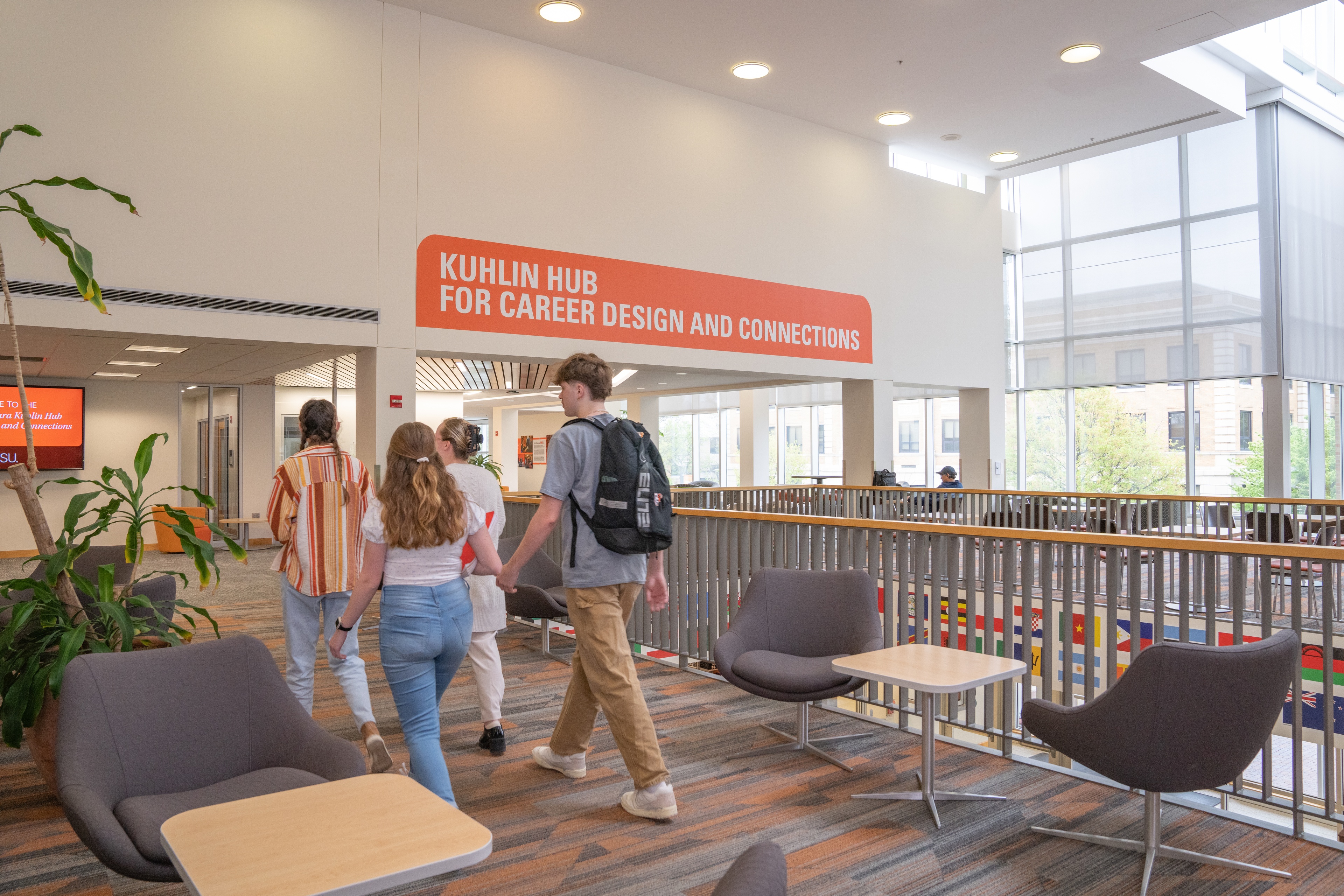 Students walk toward the Michael and Sara Kuhlin Hub for Career Design and Connections on the second floor of the Bowen-Thompson Student Union