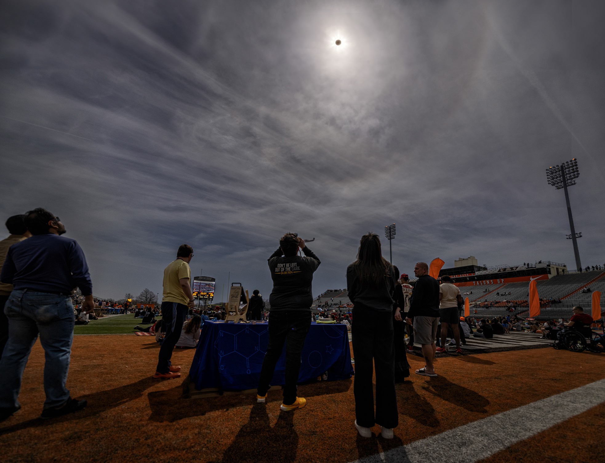  People watch the total solar eclipse in a football stadium 